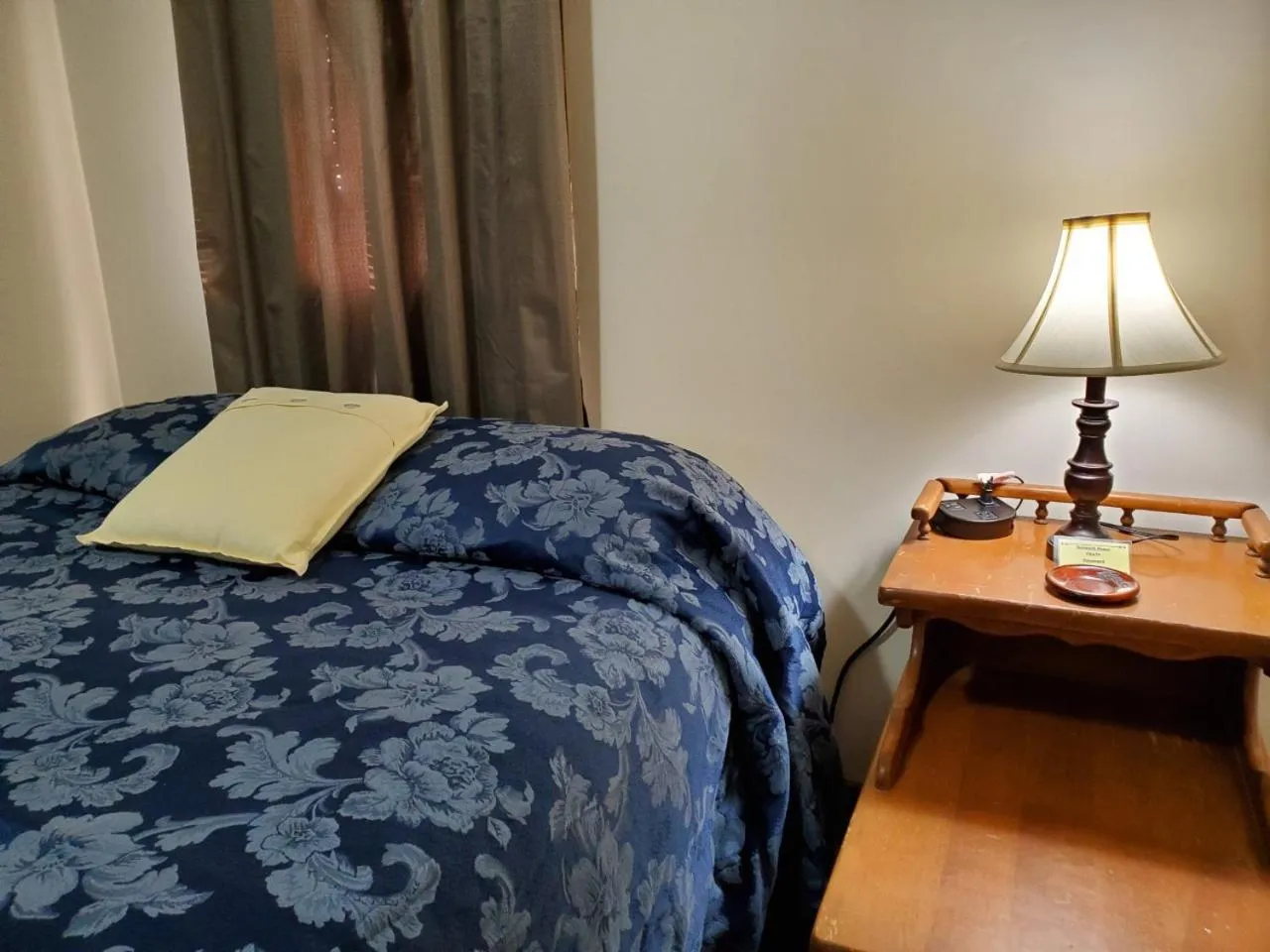 Bed in Little River Inn Motel