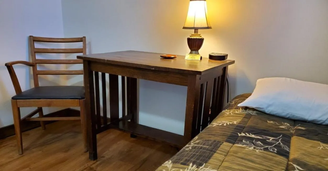 Bed in Little River Inn Motel