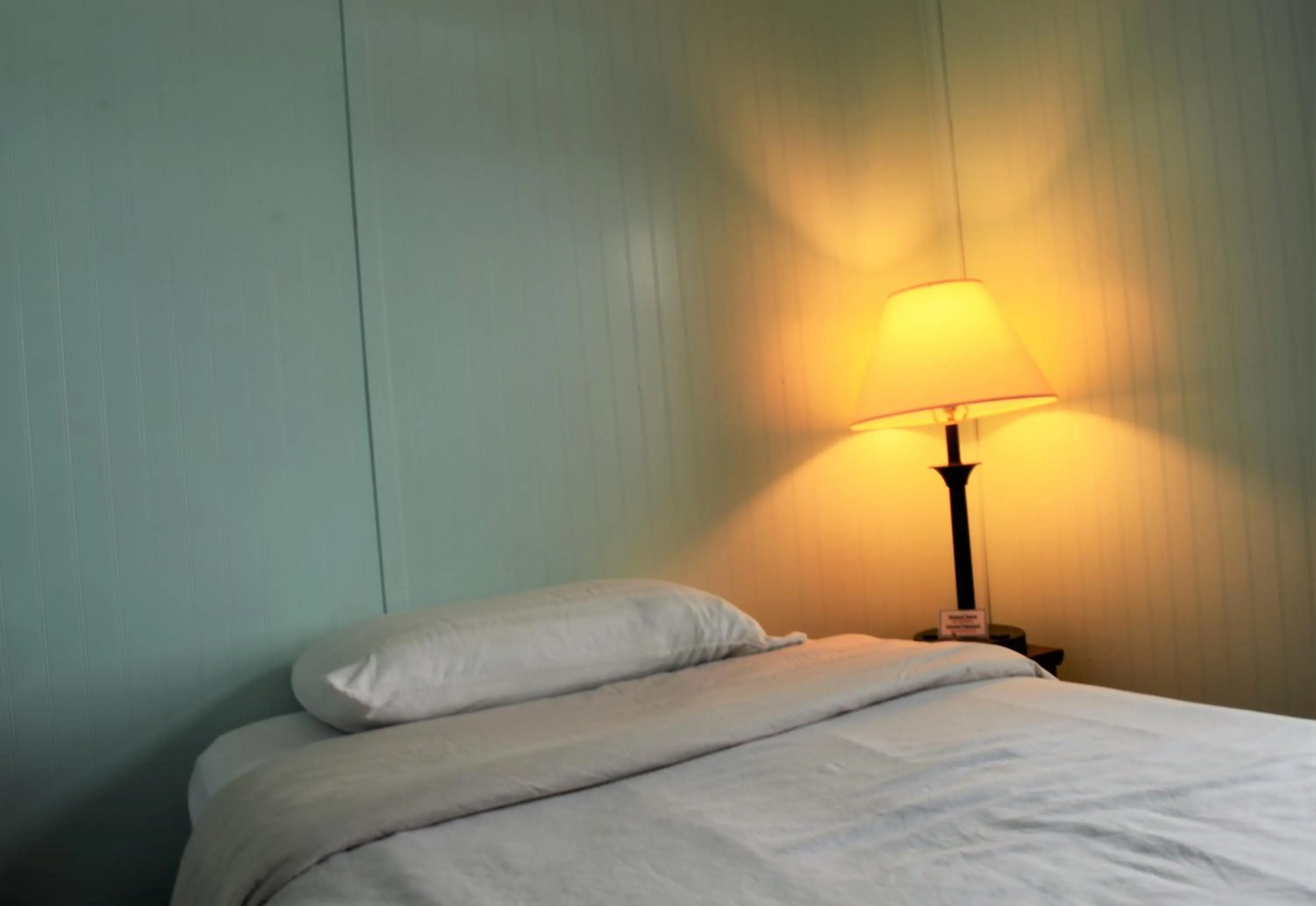 Bed in Little River Inn Motel