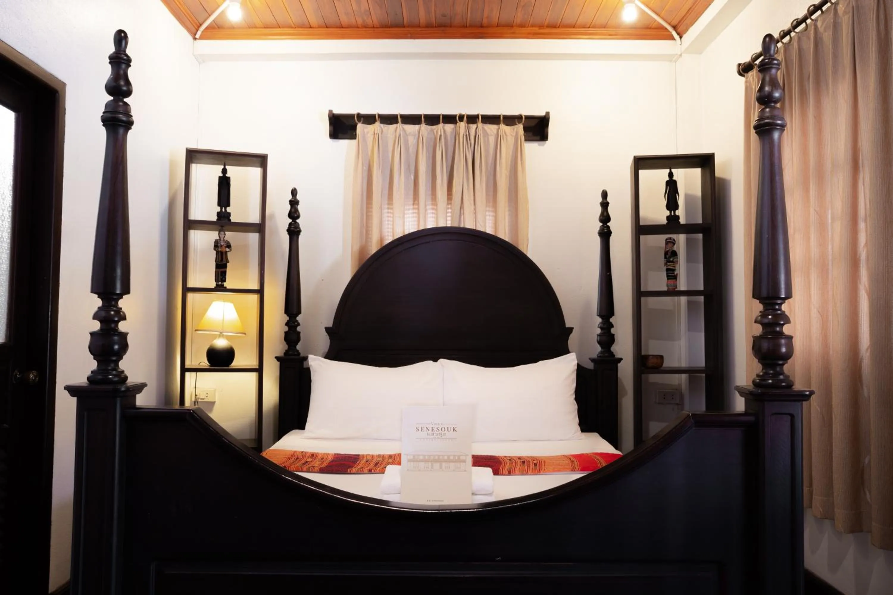 Bed in Villa Senesouk Luang Prabang