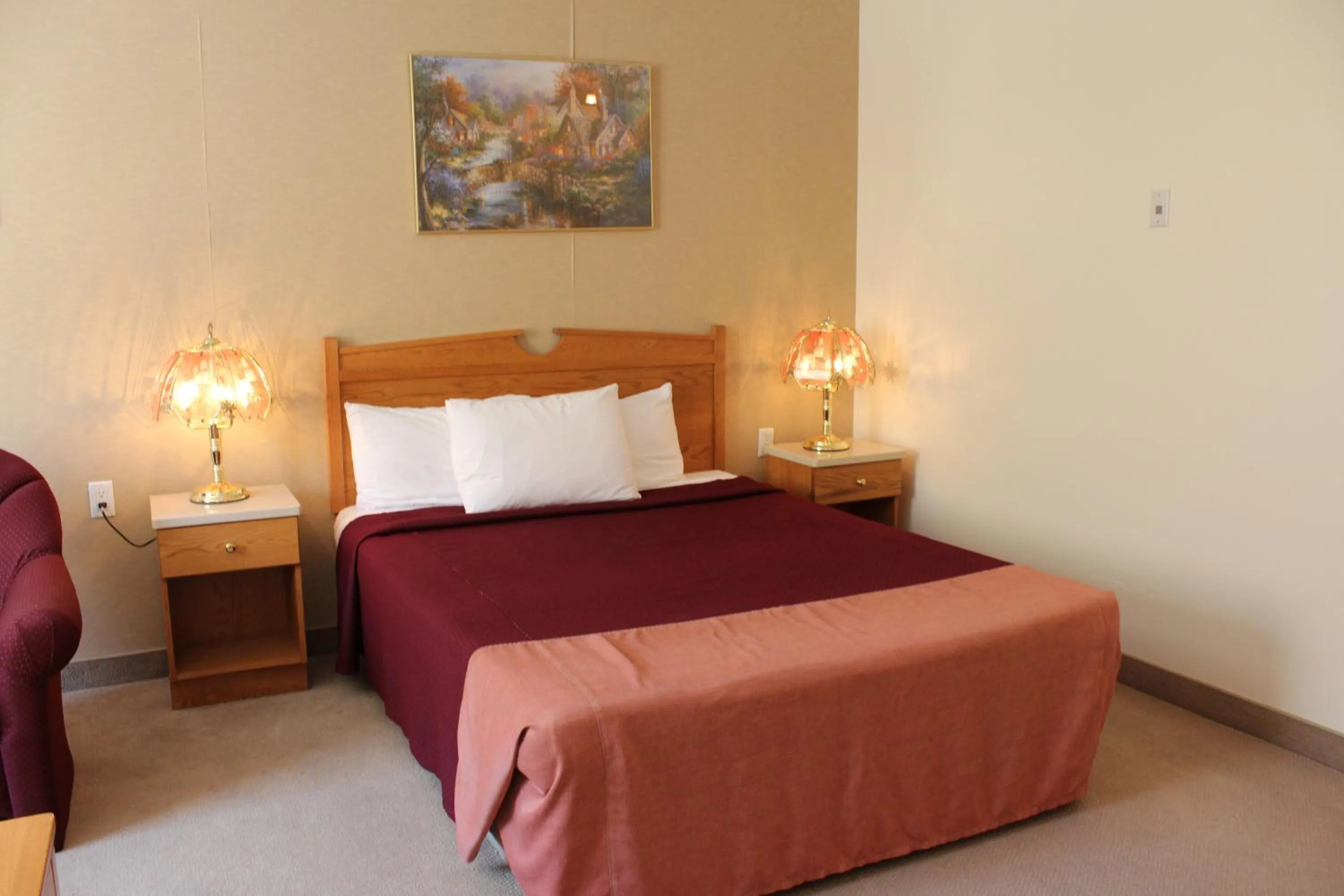 Bed in Western Budget Motel Ponoka