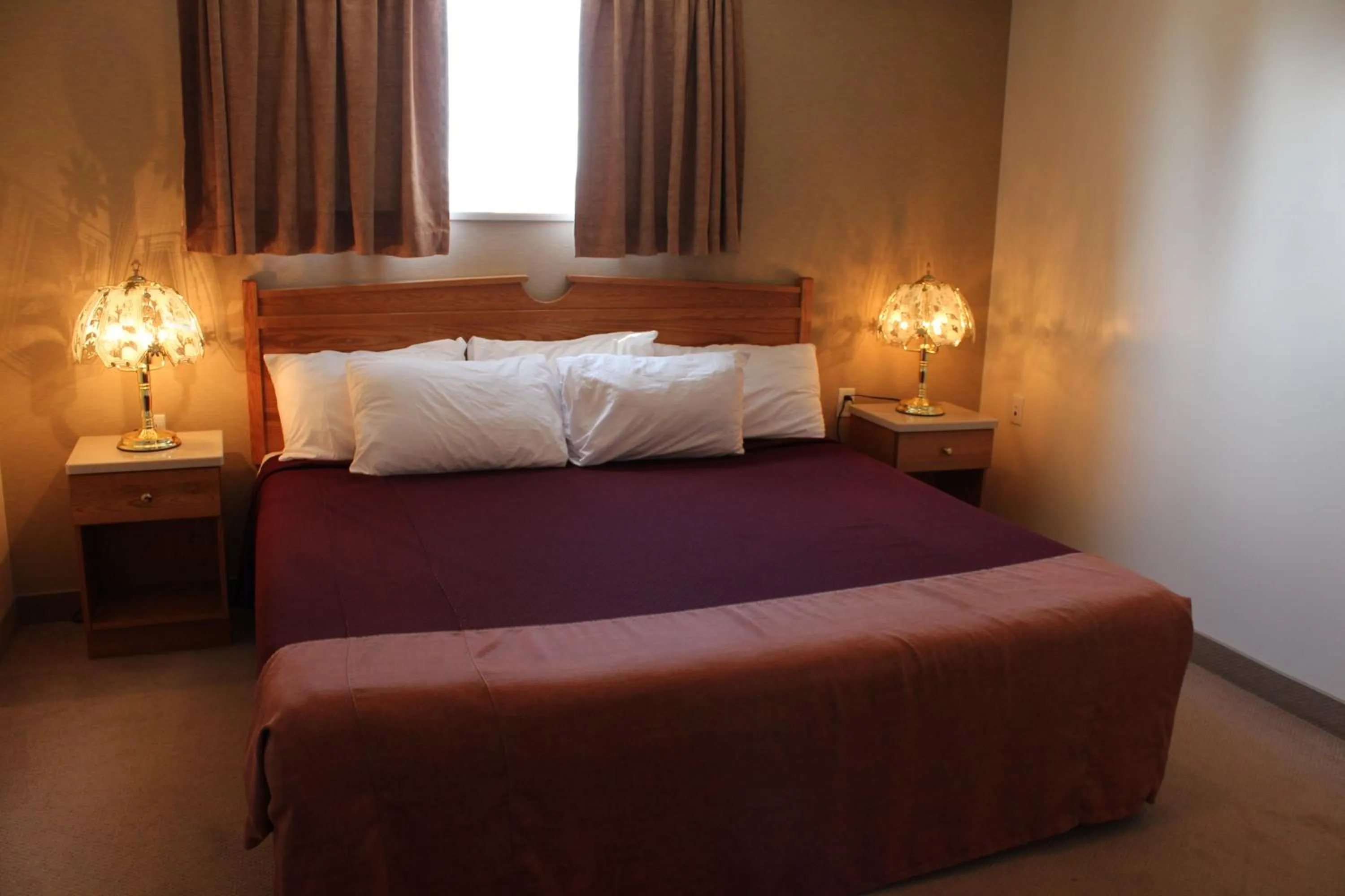 Bed in Western Budget Motel Ponoka