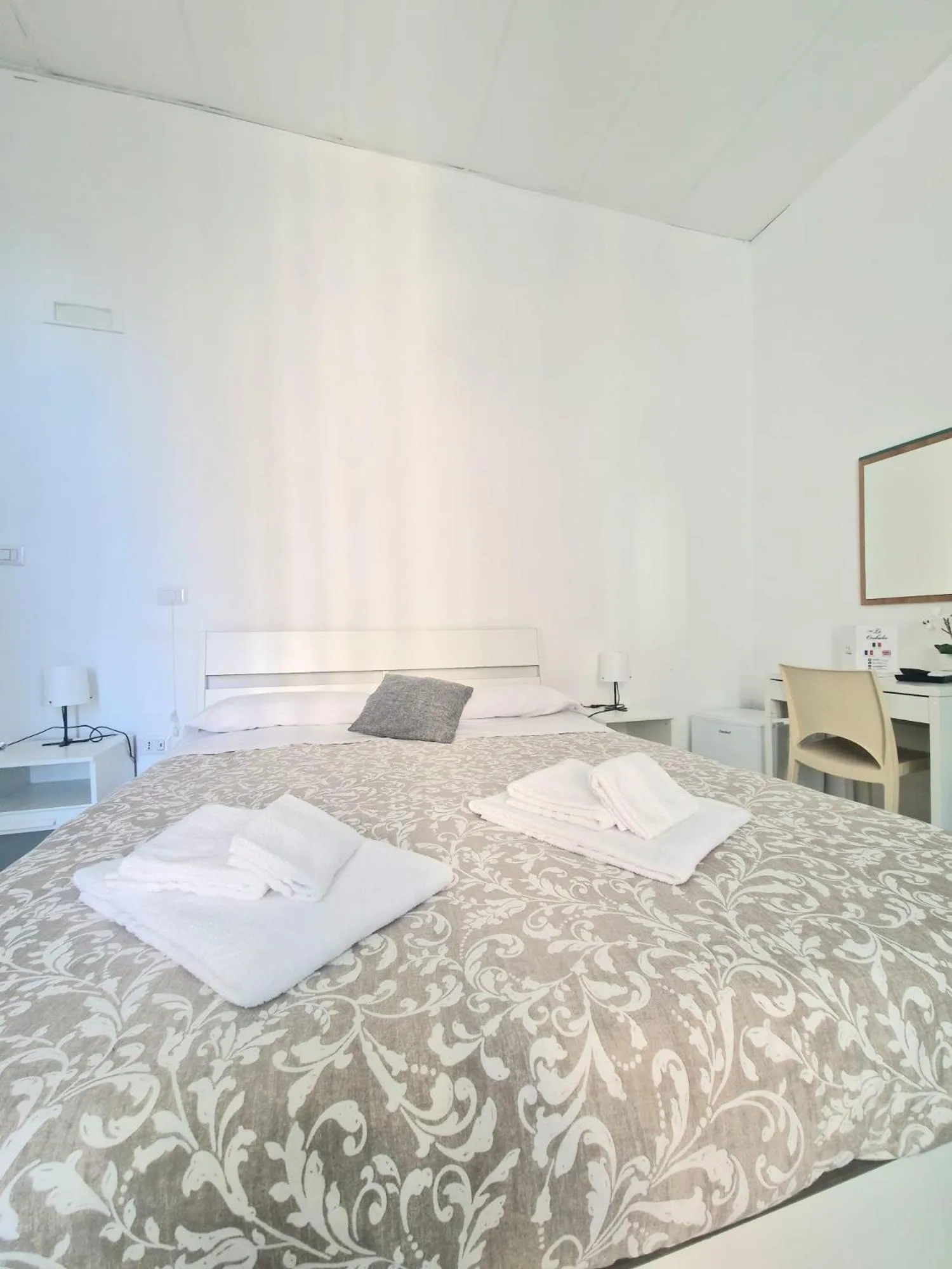 Bed in Hotel Le Orchidee