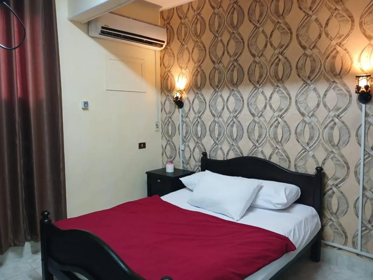 Bed in New Palace Hotel