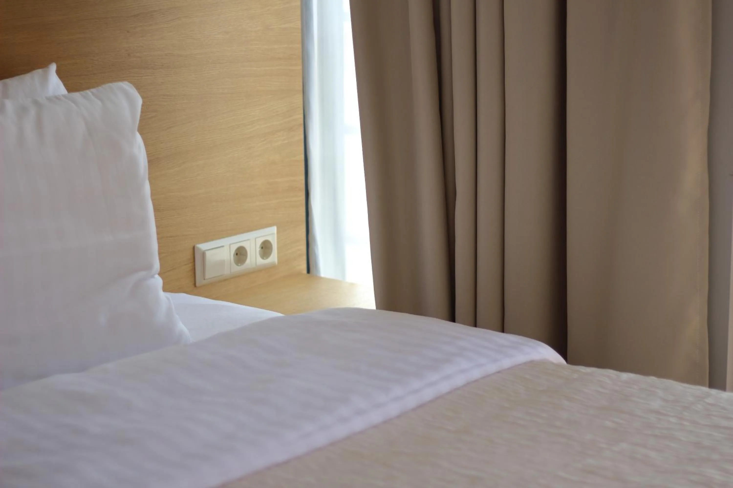 Bed in Hotel Kolumbs