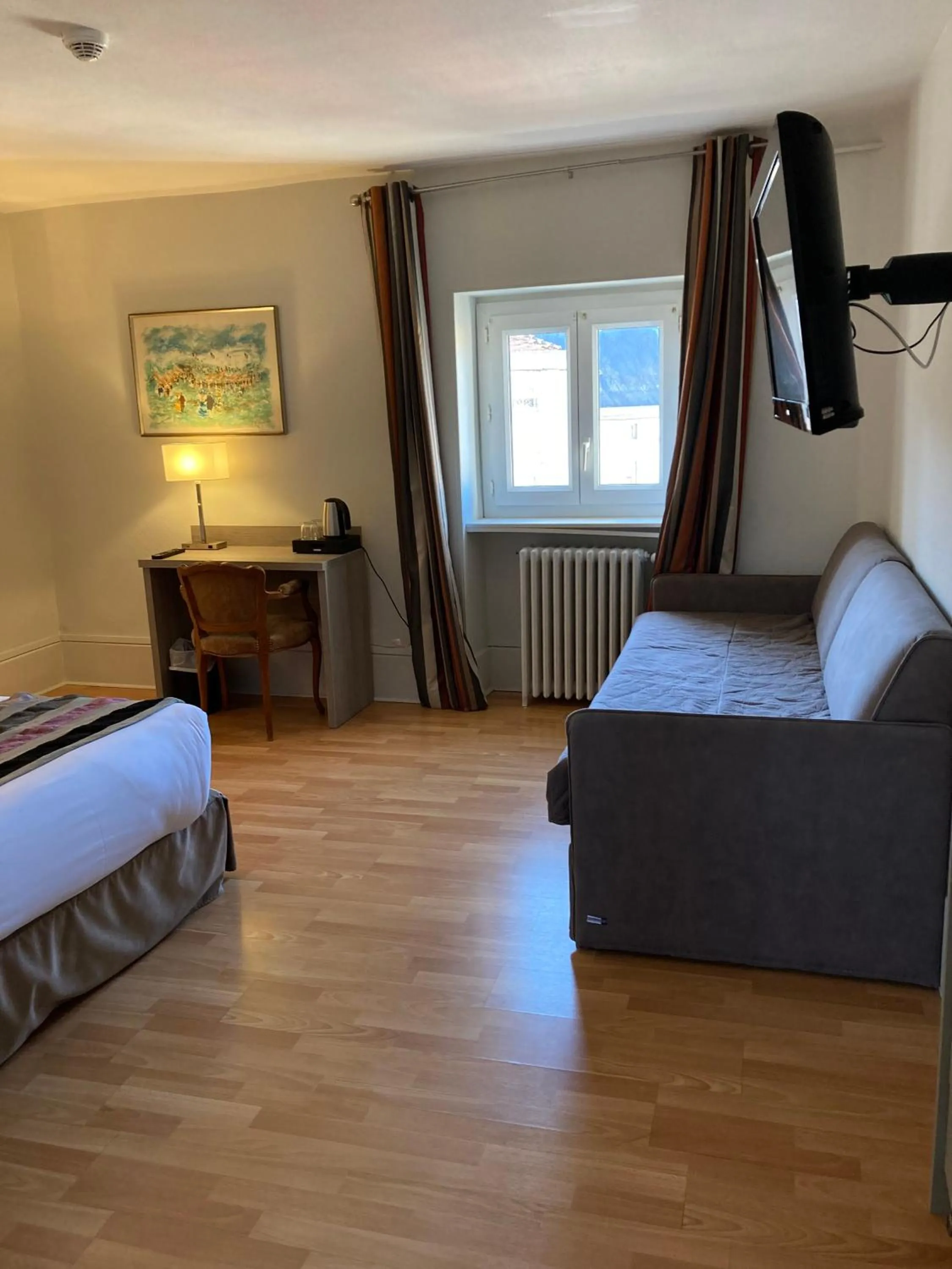 Bed in Hôtel de la Poste