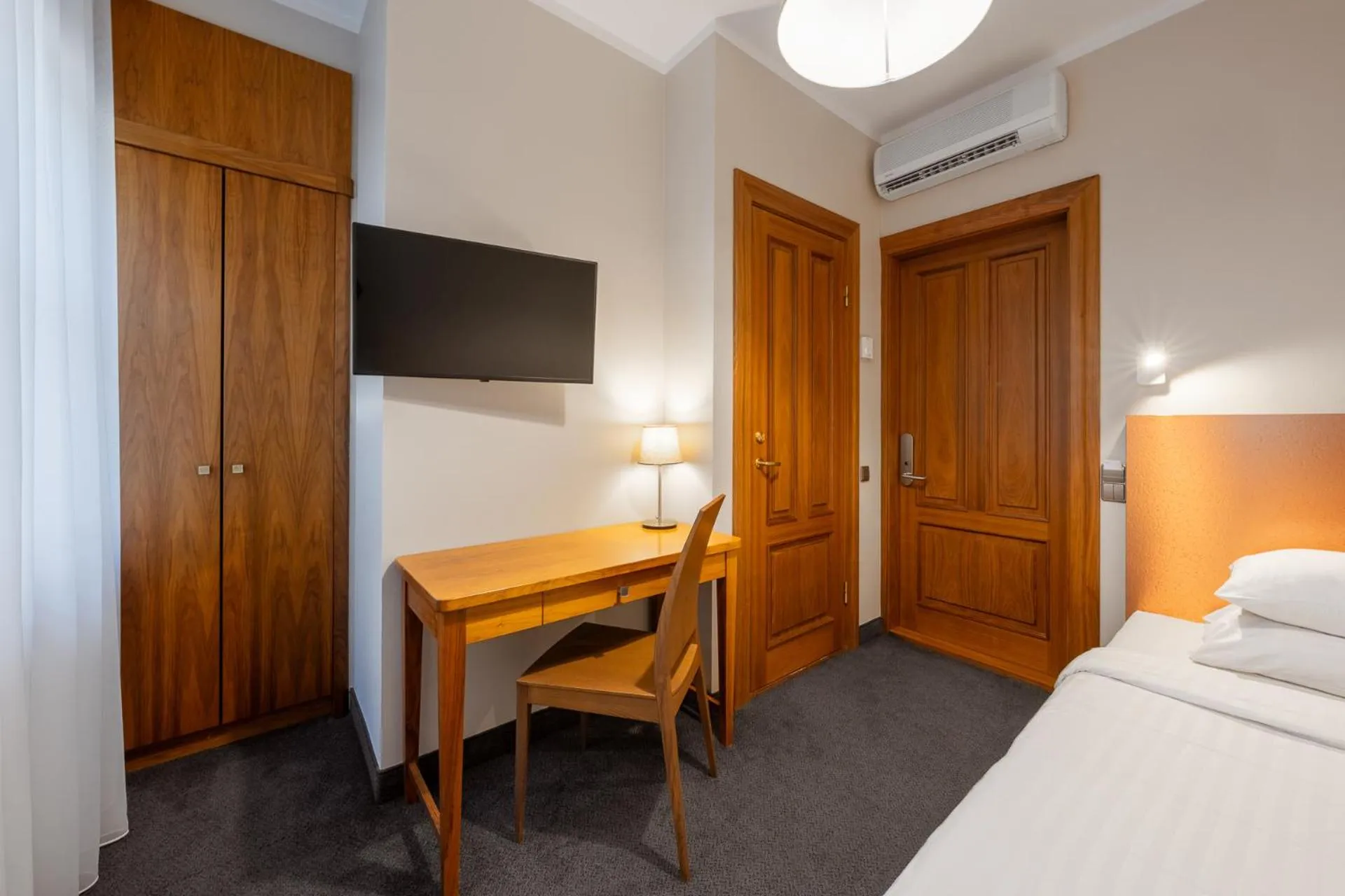 Seating area, Bed in RIJA Riga City Centre Hotel