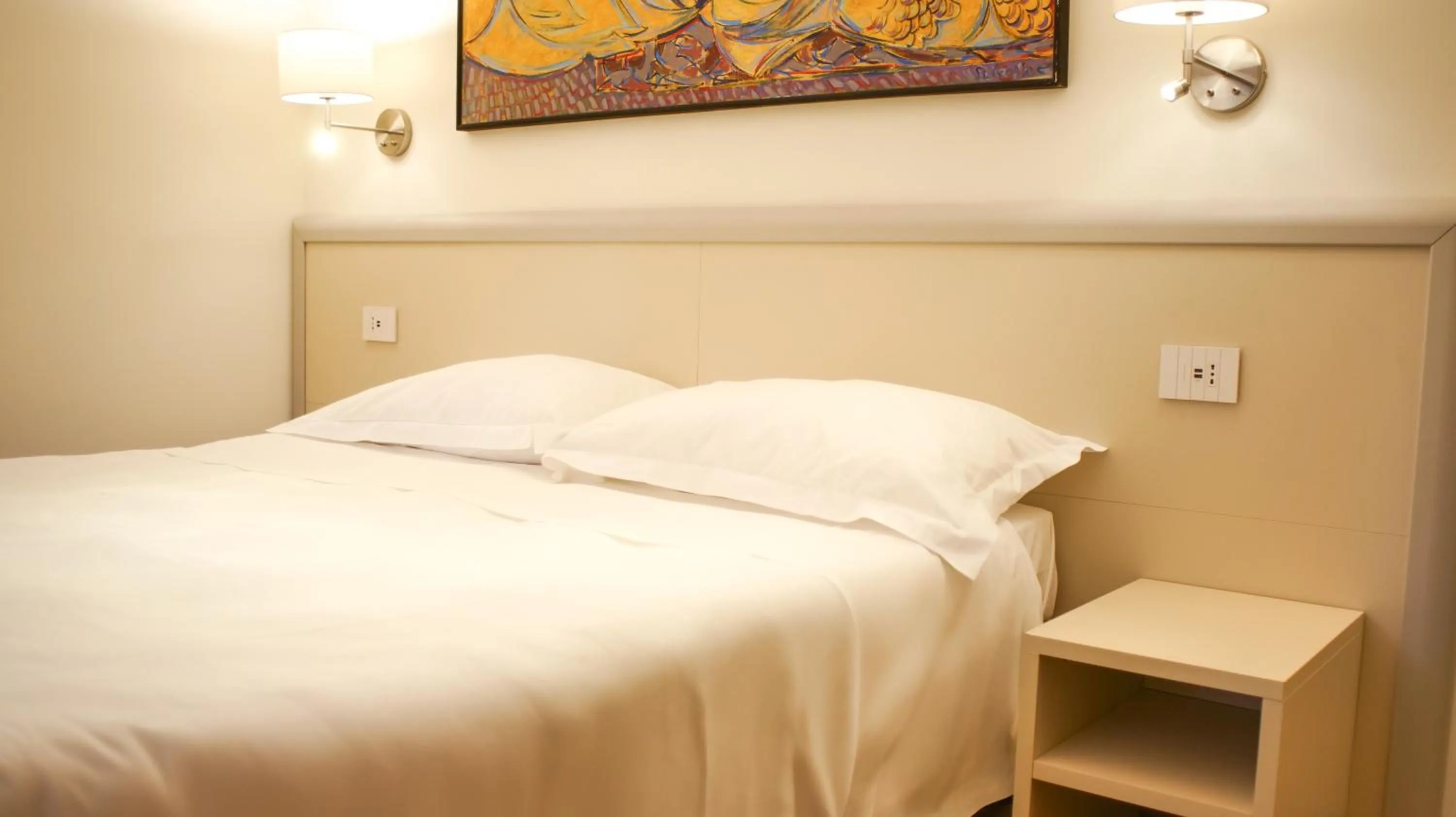 Bed in Rex Hotel Residence