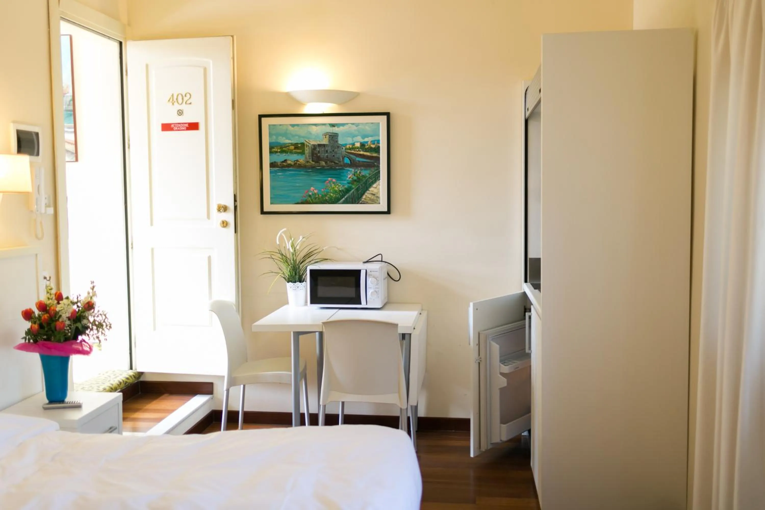 Seating area, Bed in Rex Hotel Residence