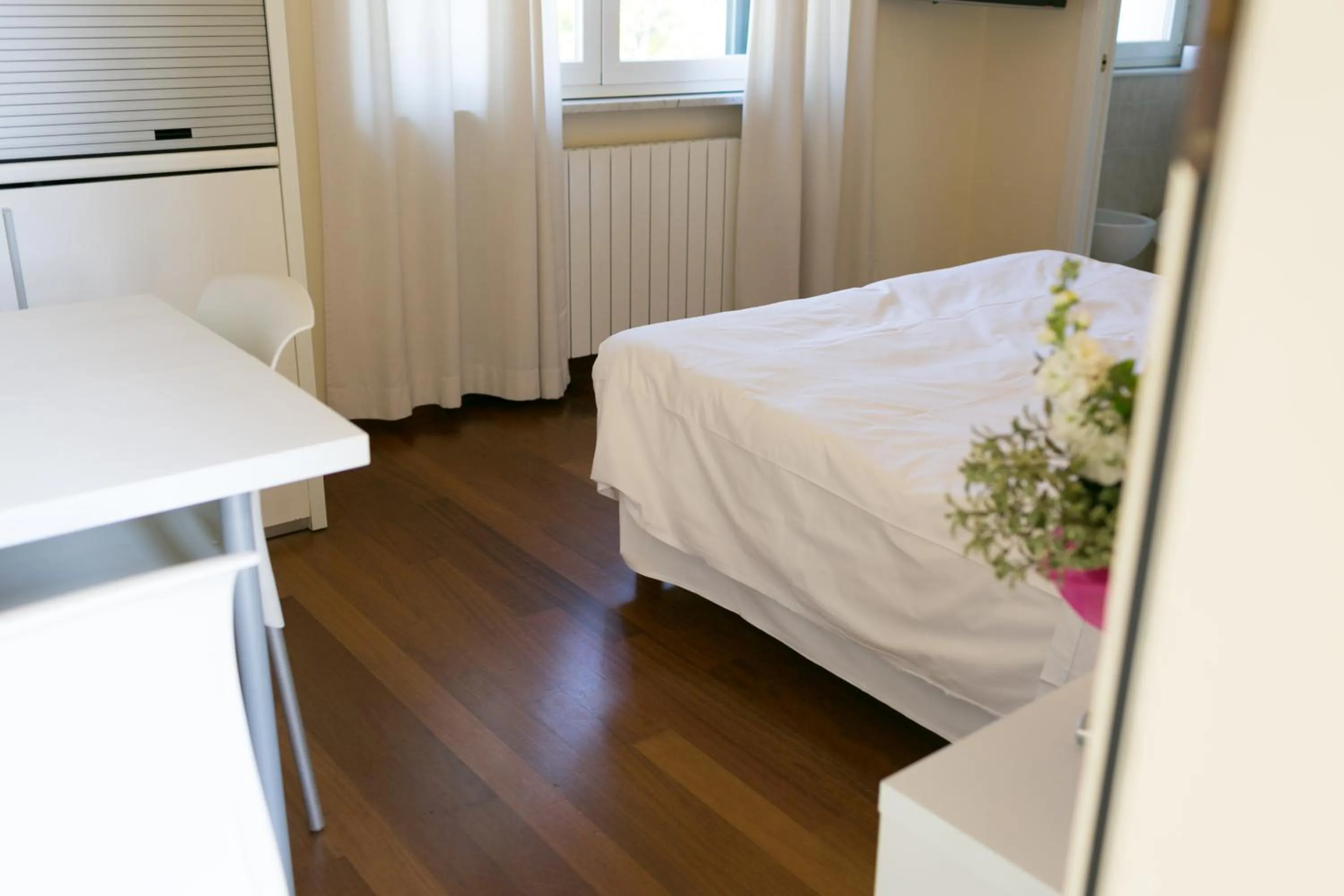 Bed in Rex Hotel Residence