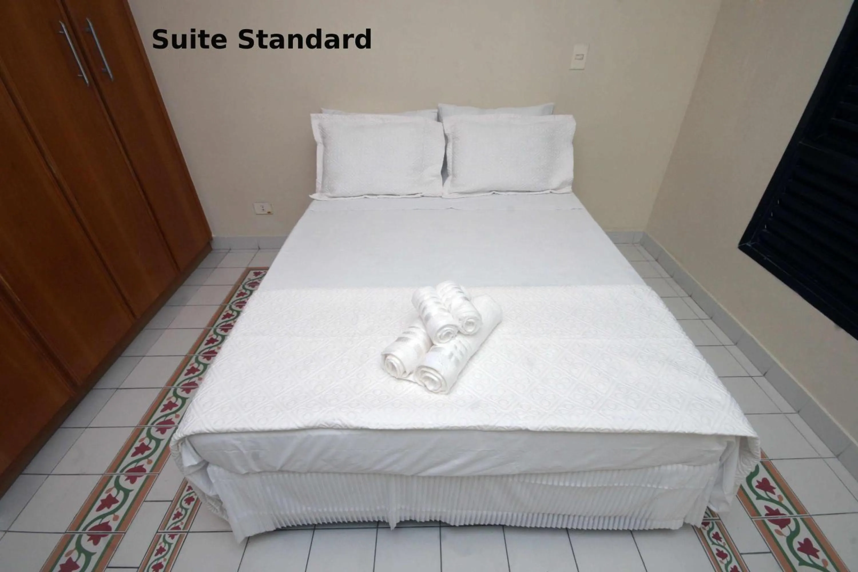 Bed in Suites Natalia Enseada