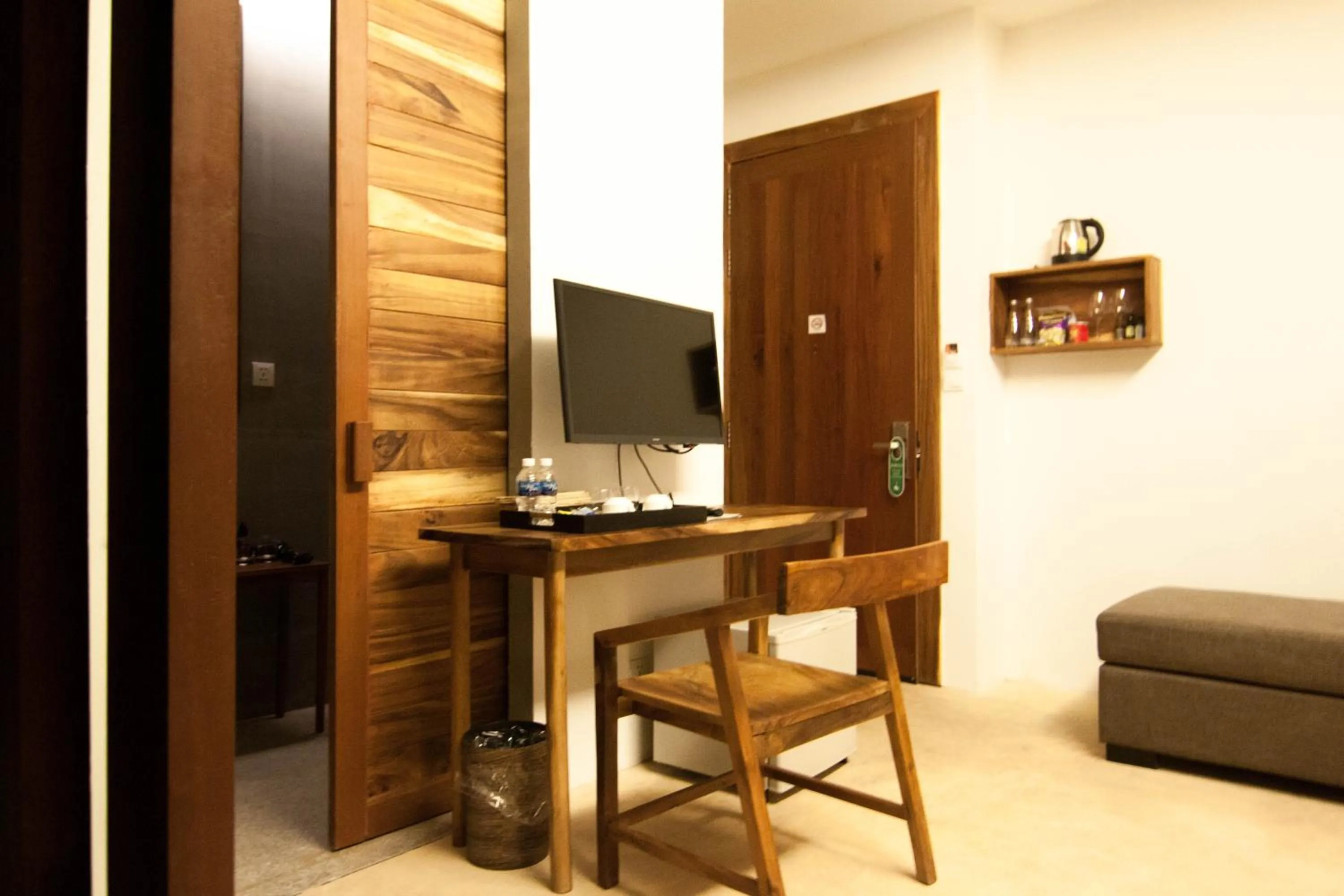 Communal lounge/ TV room in Sarina Boutique Hotel