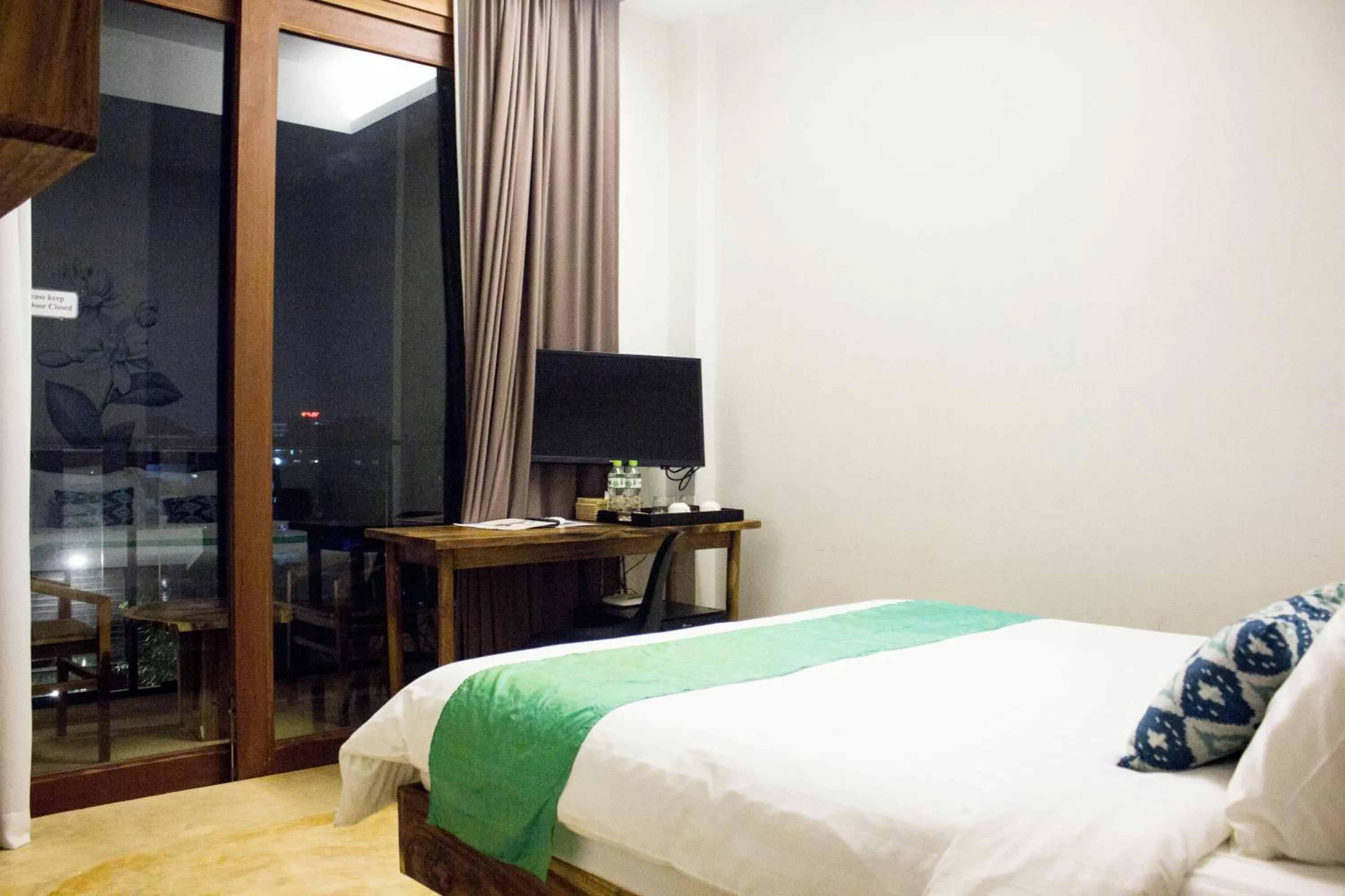 Bed in Sarina Boutique Hotel