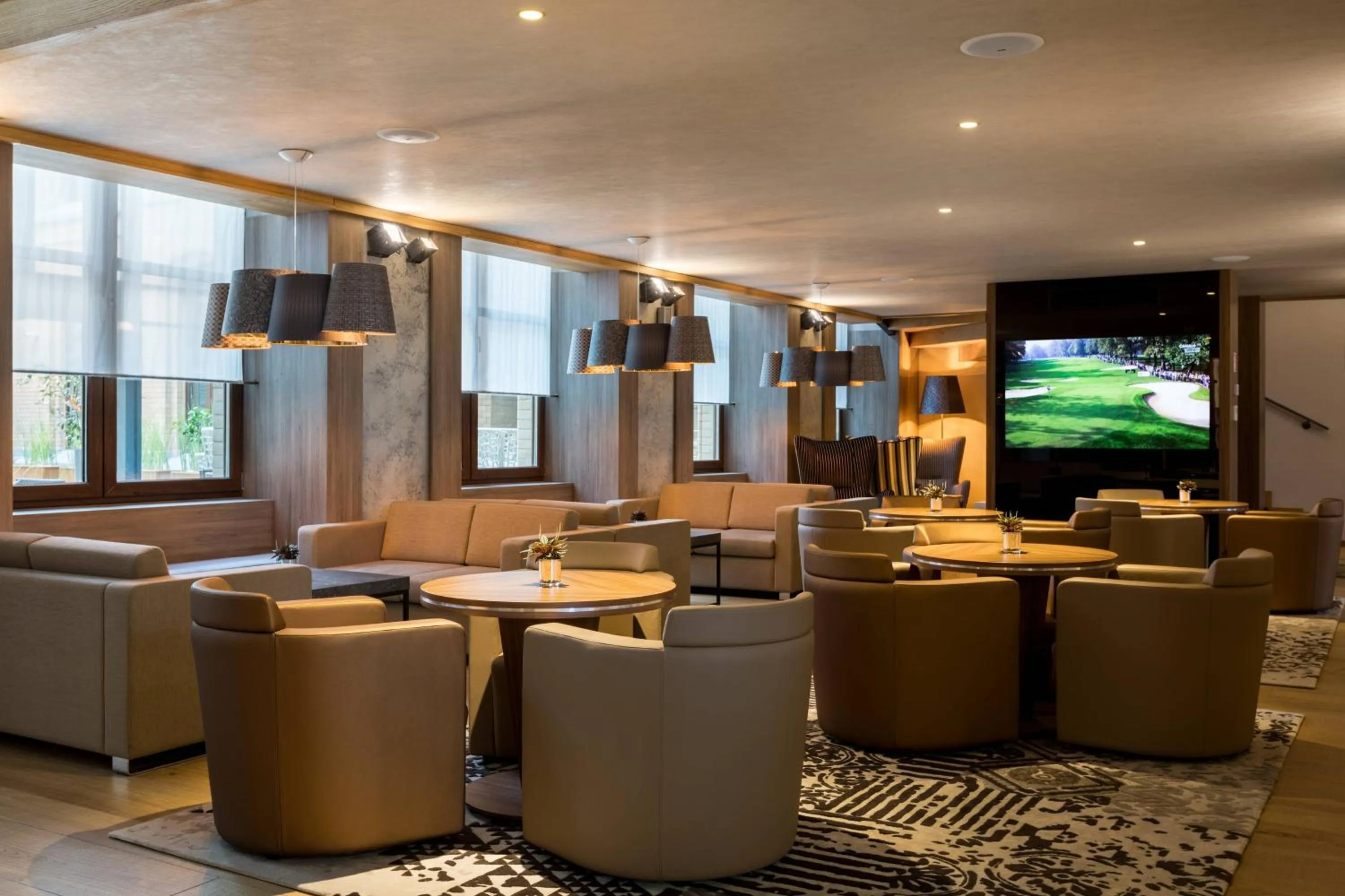 Lounge or bar in AC Hotel by Marriott Wroclaw