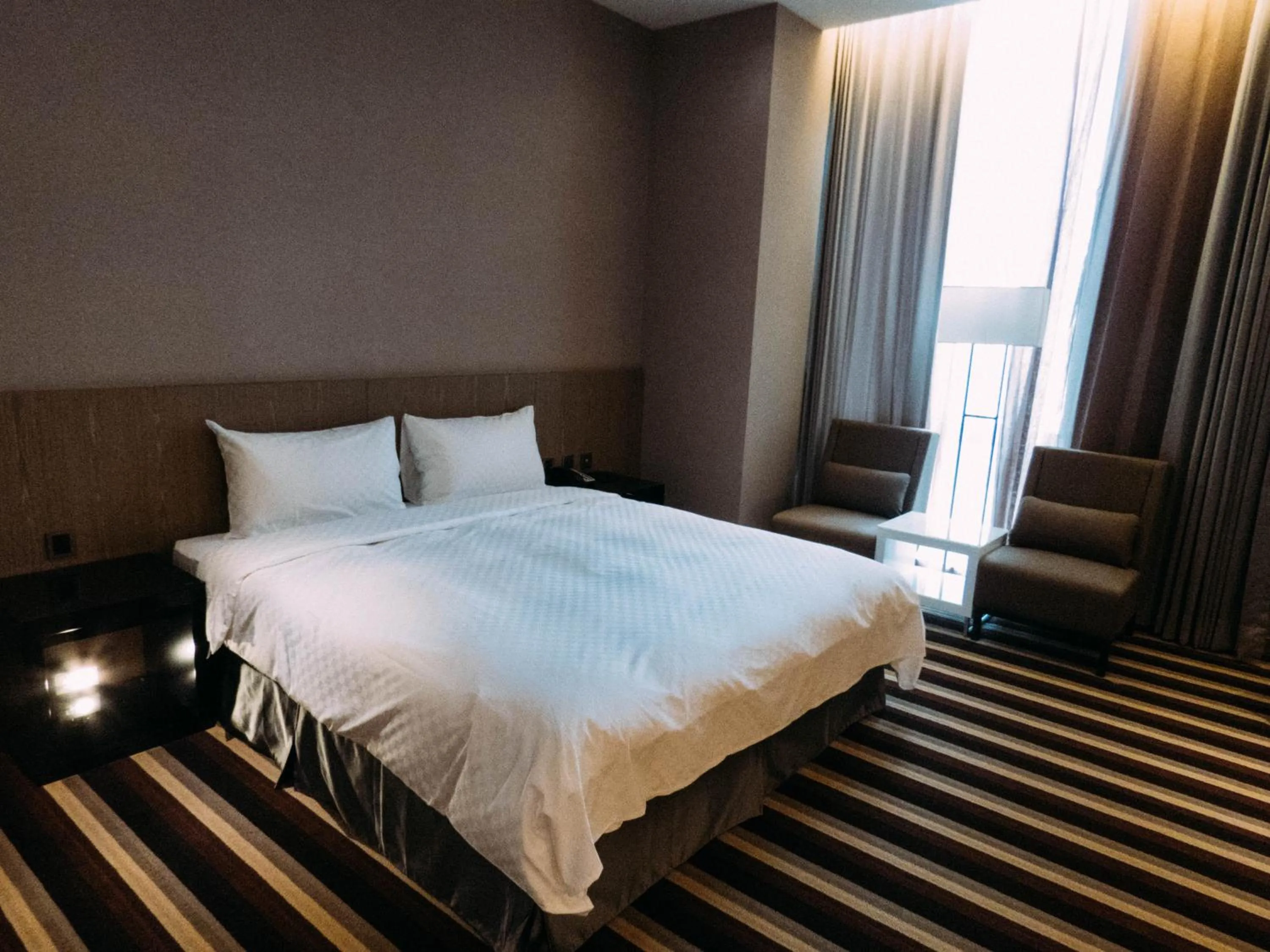 Bed in Grand Royal Hotel