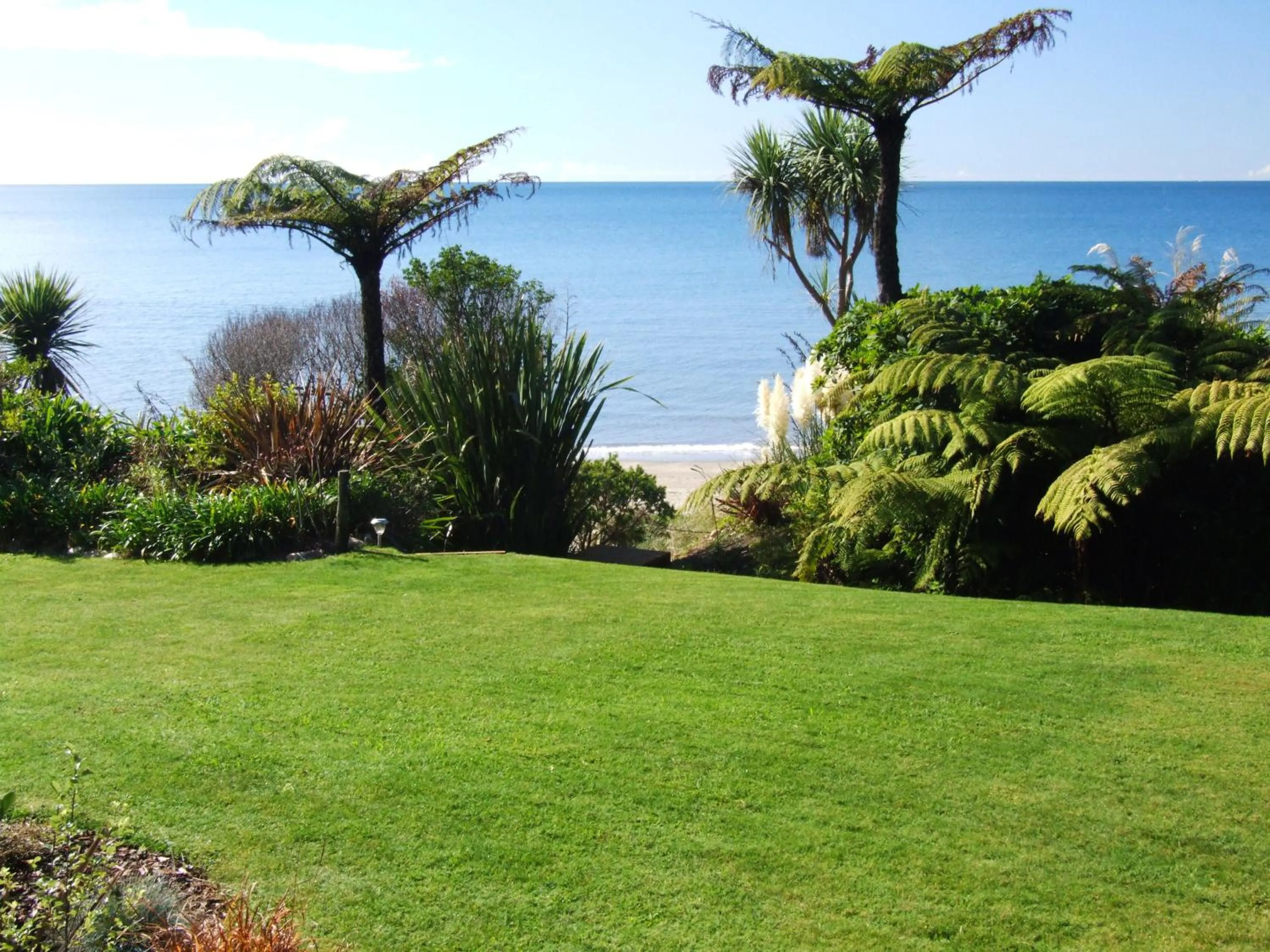 Garden view in Adrift In Golden Bay- Absolute Beachfront Villas