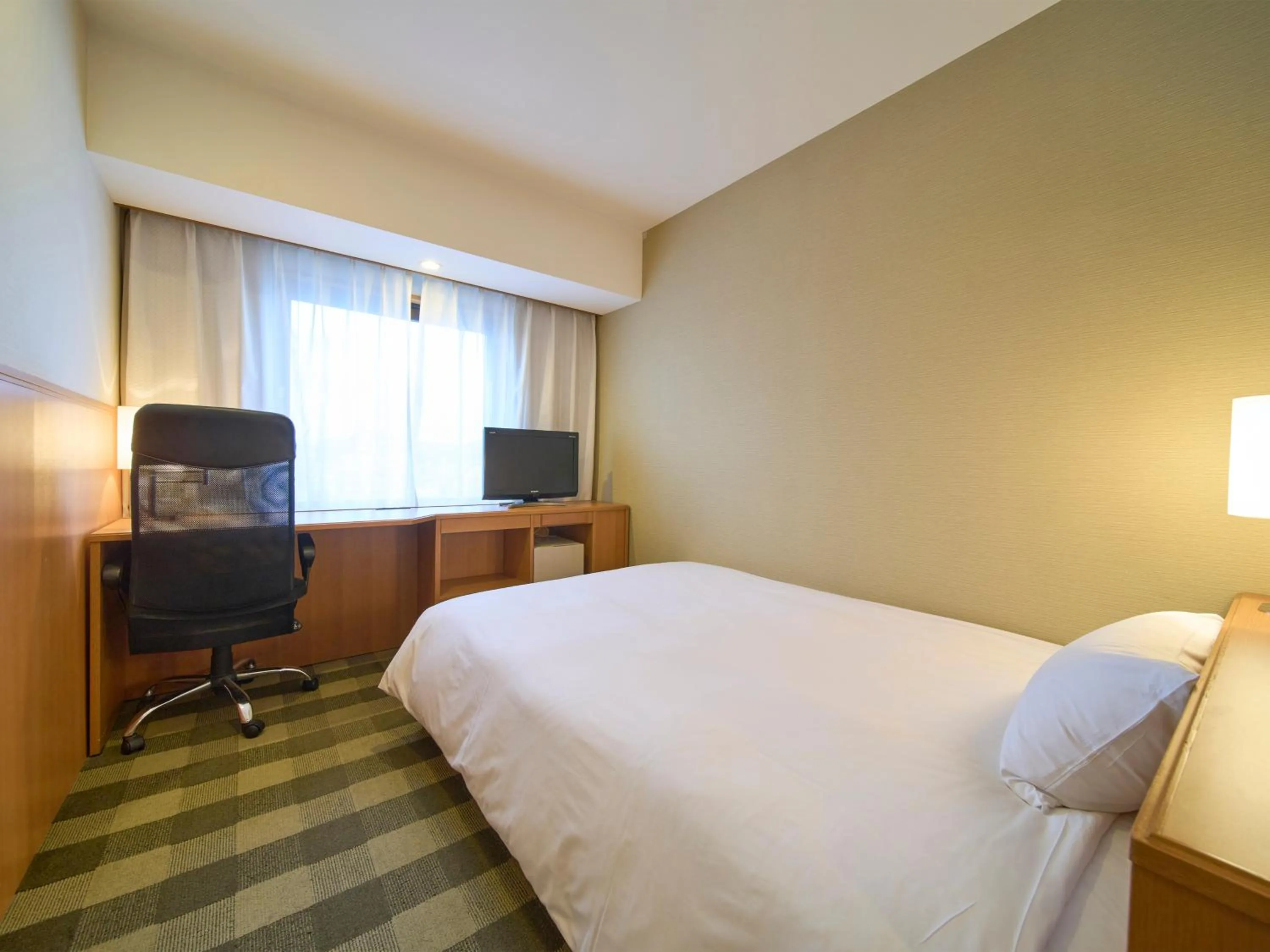 Bed in Hotel Granvia Wakayama