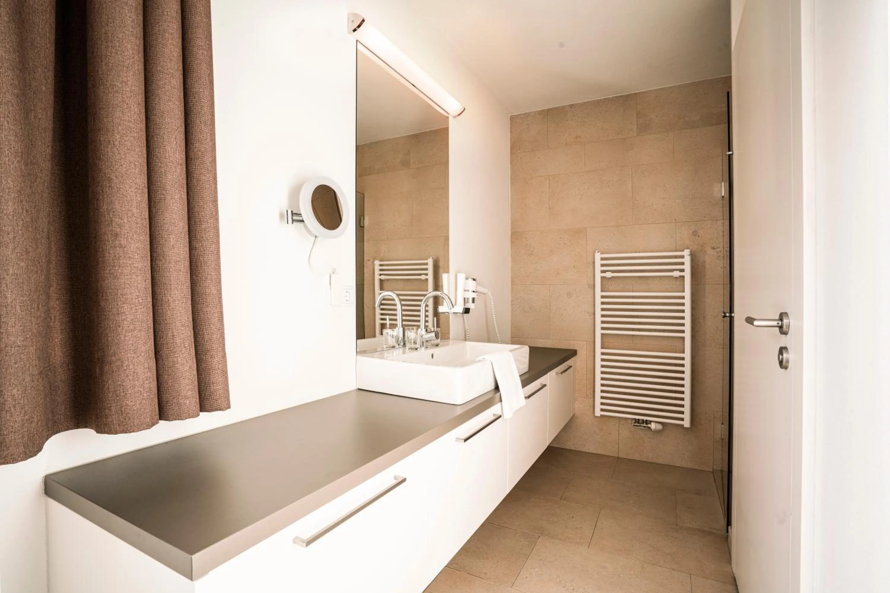 Bathroom in Tauernresidence Radstadt by ALPS RESORTS