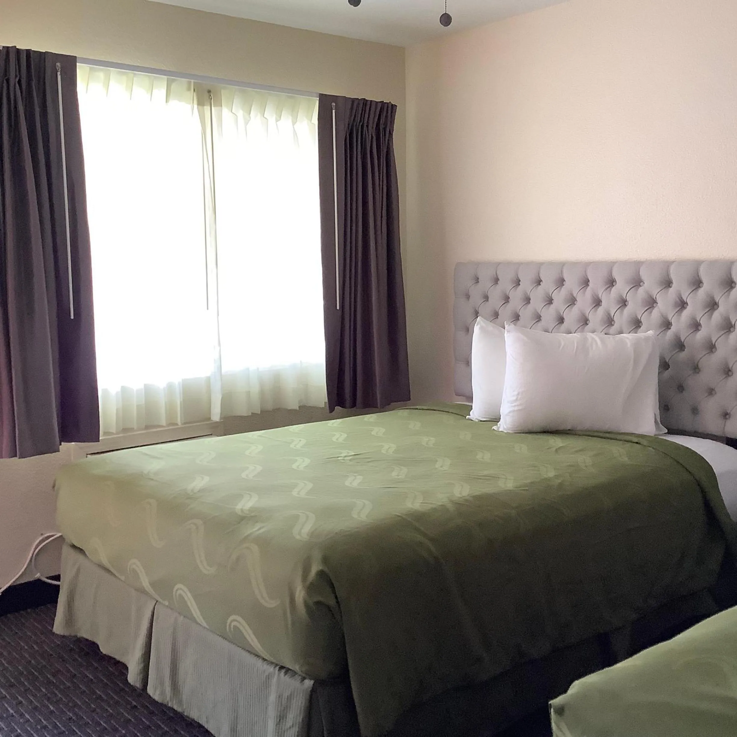 Bed in National 9 Motel