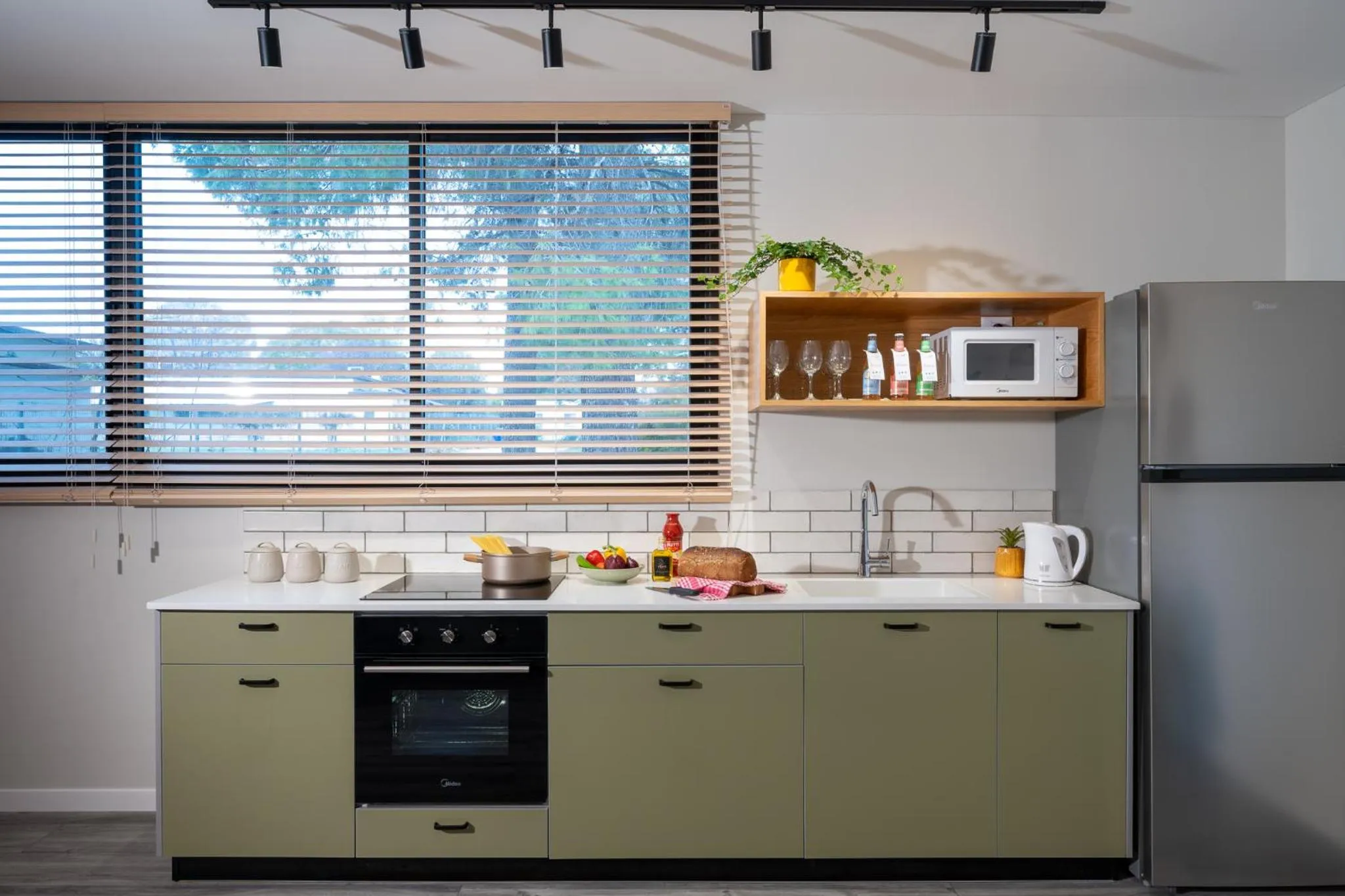 Kitchen or kitchenette in Erettz Dafna Travel Hotel