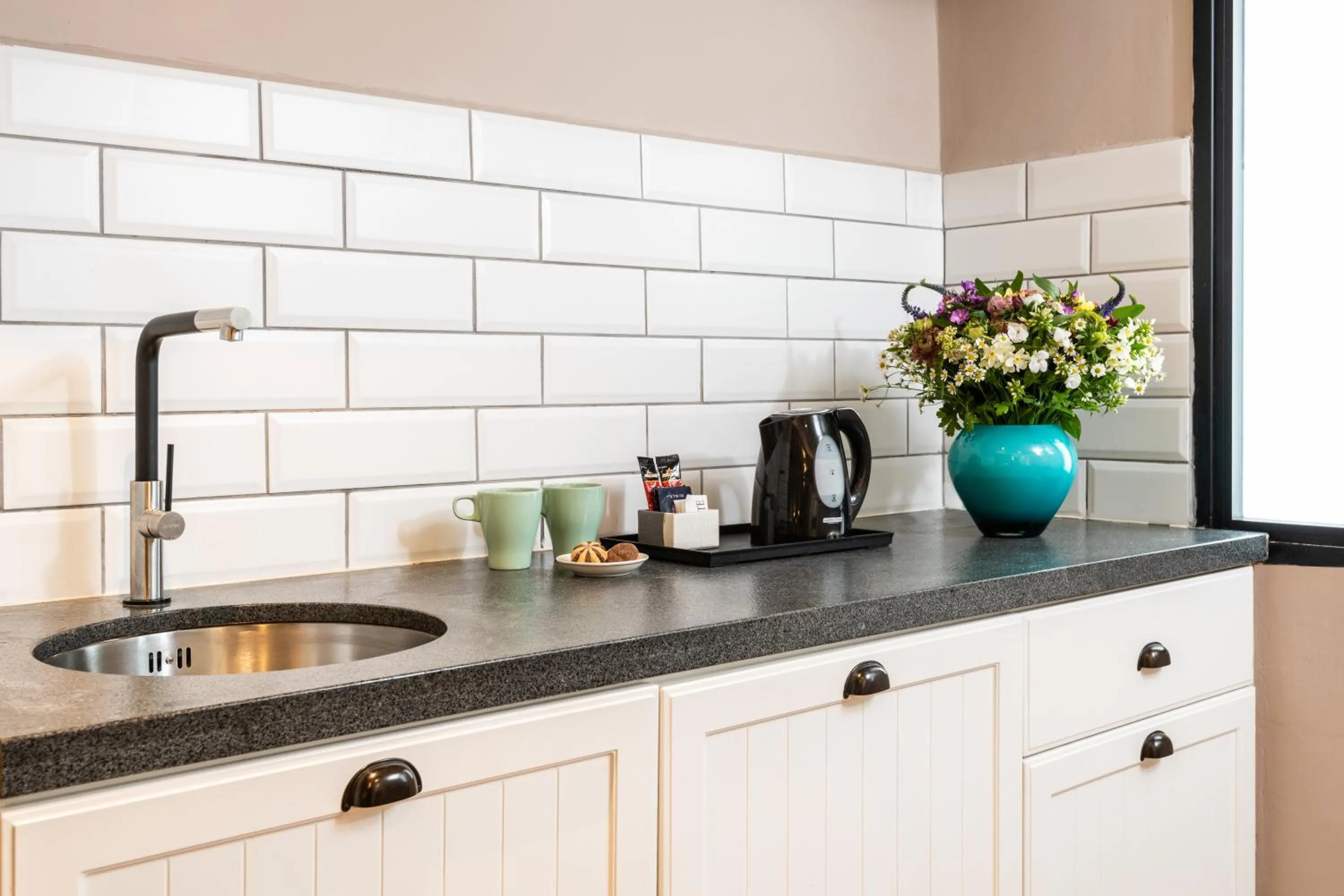 Kitchen or kitchenette in Erettz Dafna Travel Hotel