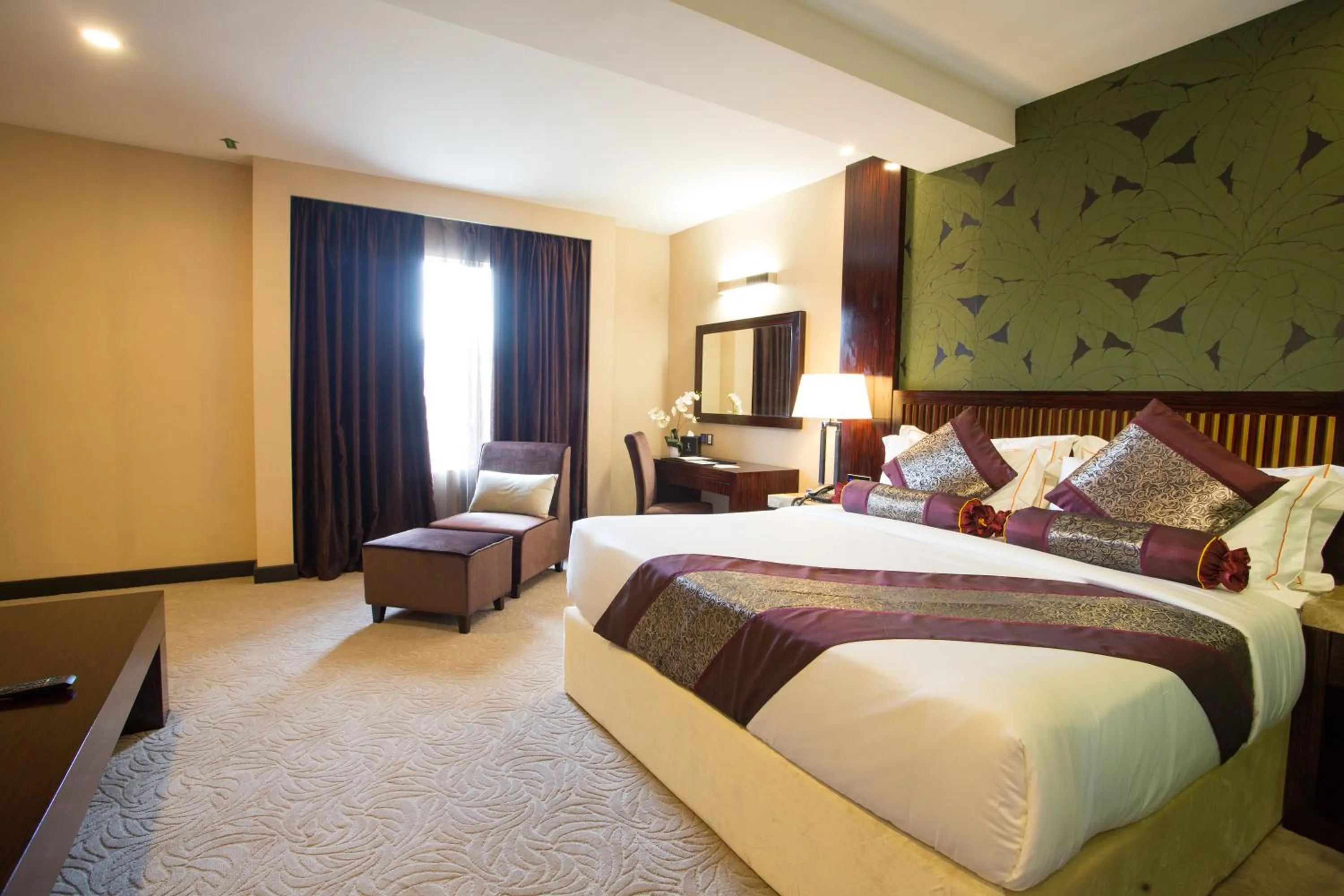 Bed in Royale Signature Hotel