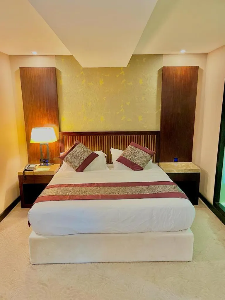 Bed in Royale Signature Hotel