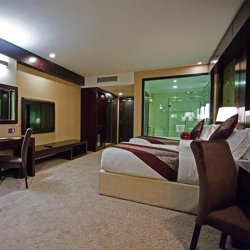 Bed in Royale Signature Hotel