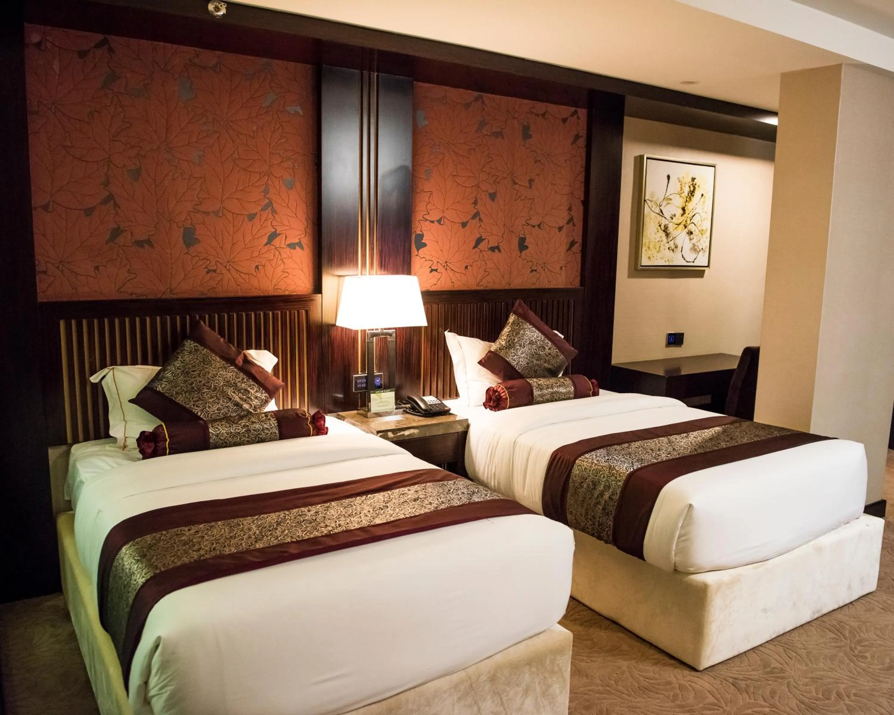 Bed in Royale Signature Hotel