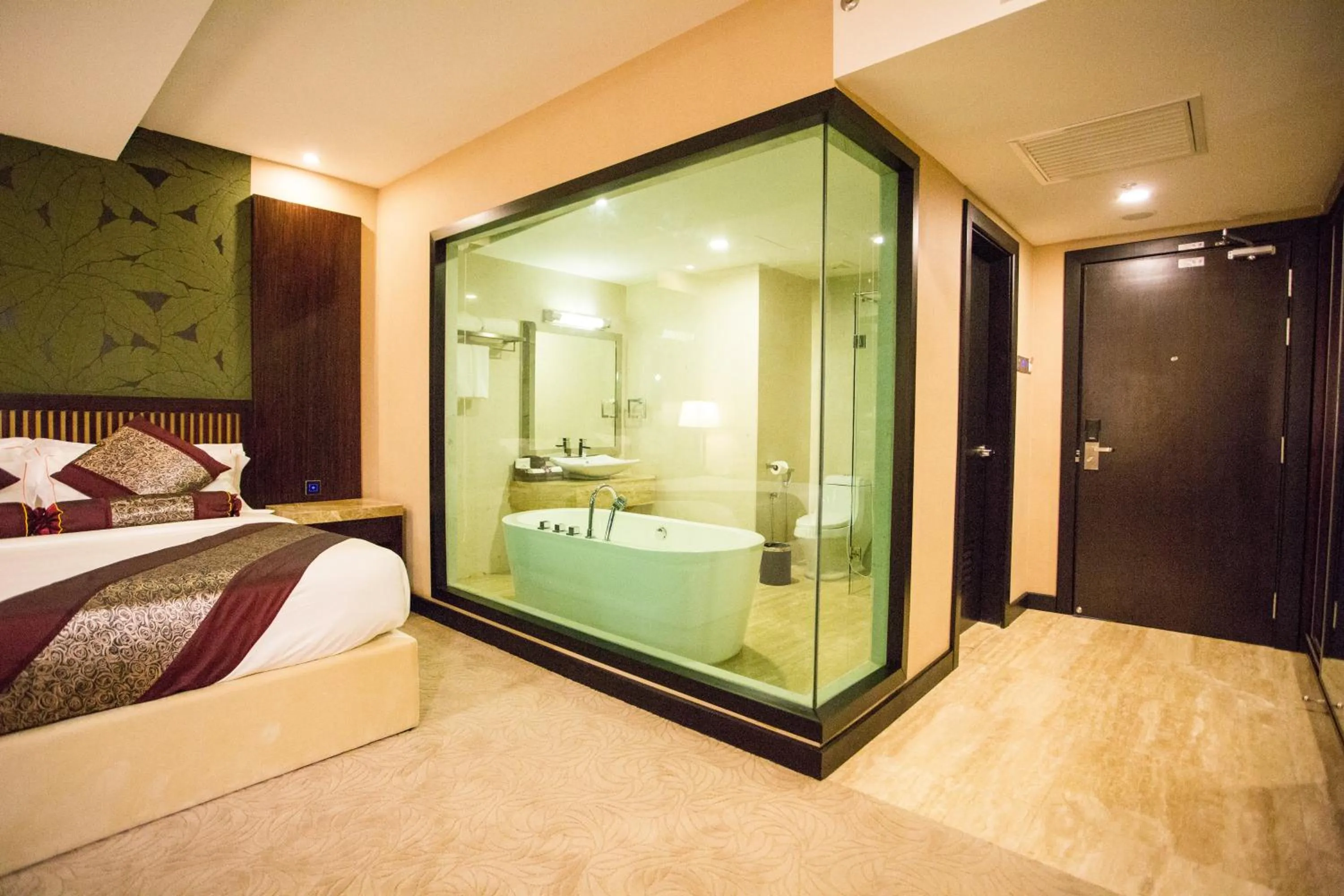 Bed in Royale Signature Hotel