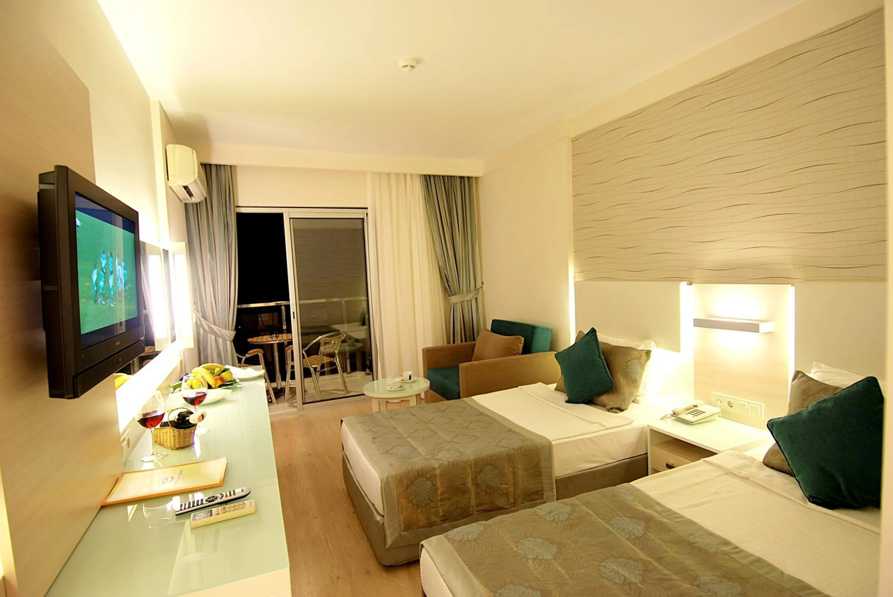 Photo of the whole room, Bed in Grand Okan Hotel