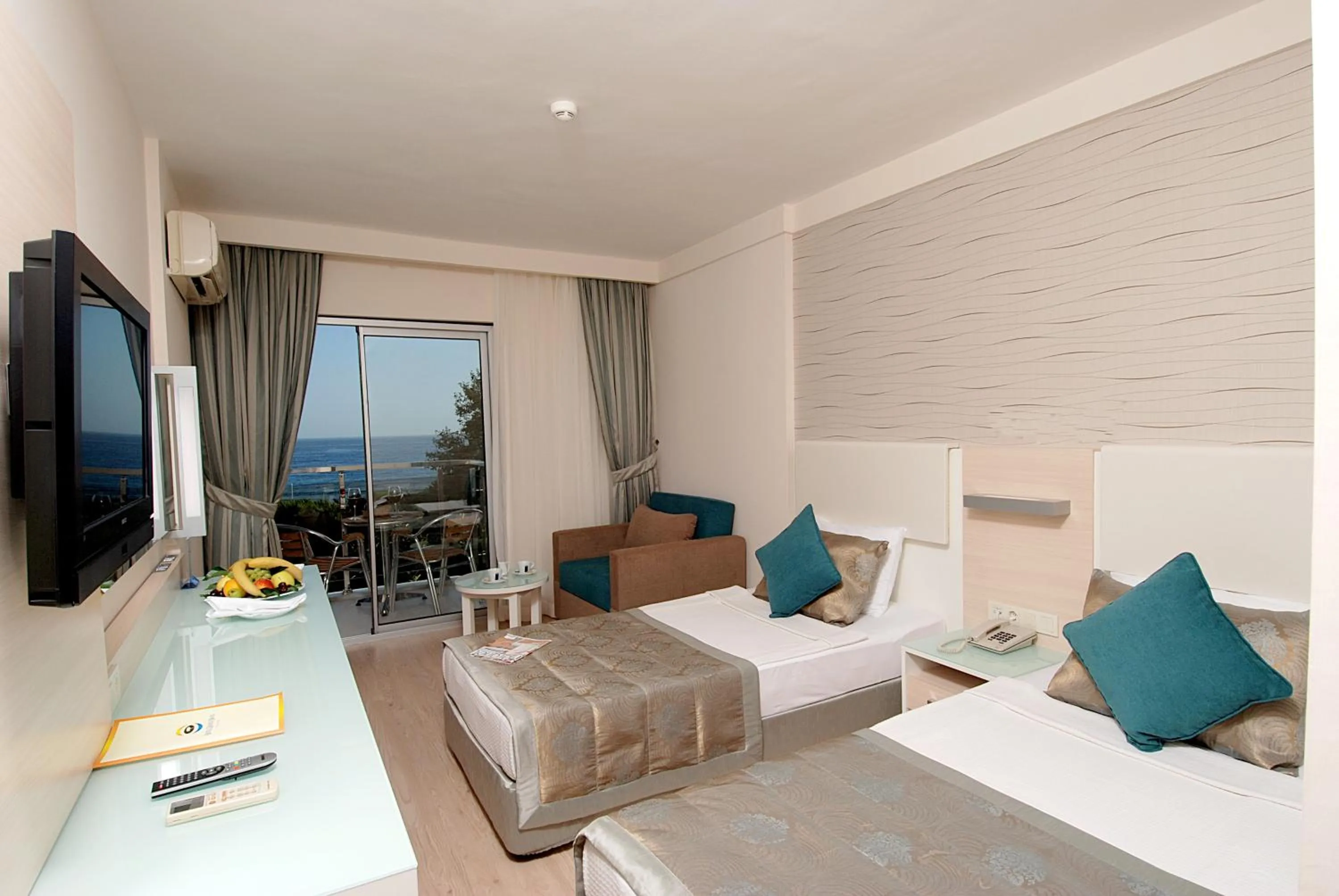 Photo of the whole room, Bed in Grand Okan Hotel