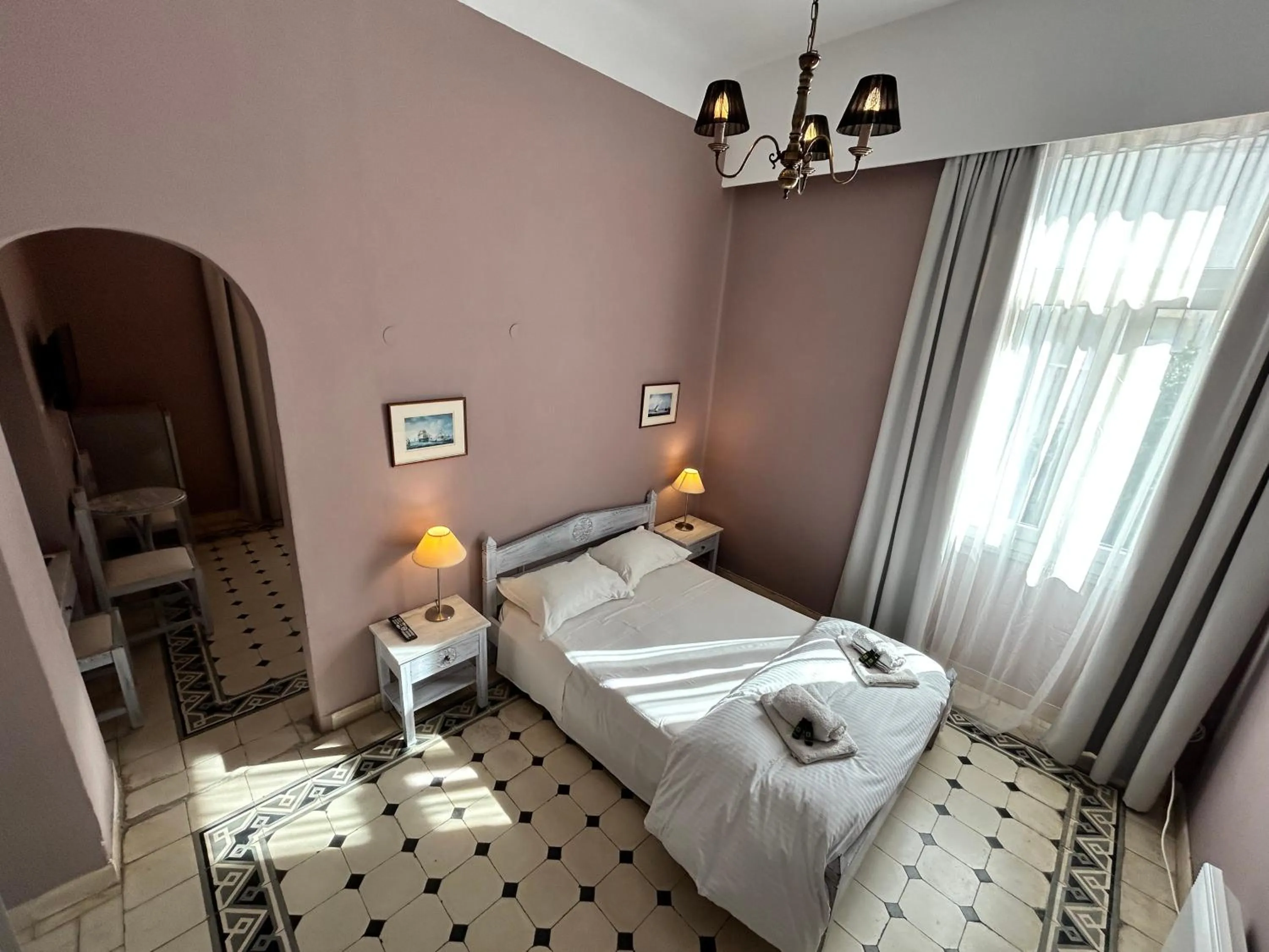 Bed in Tinion Urban Hotel