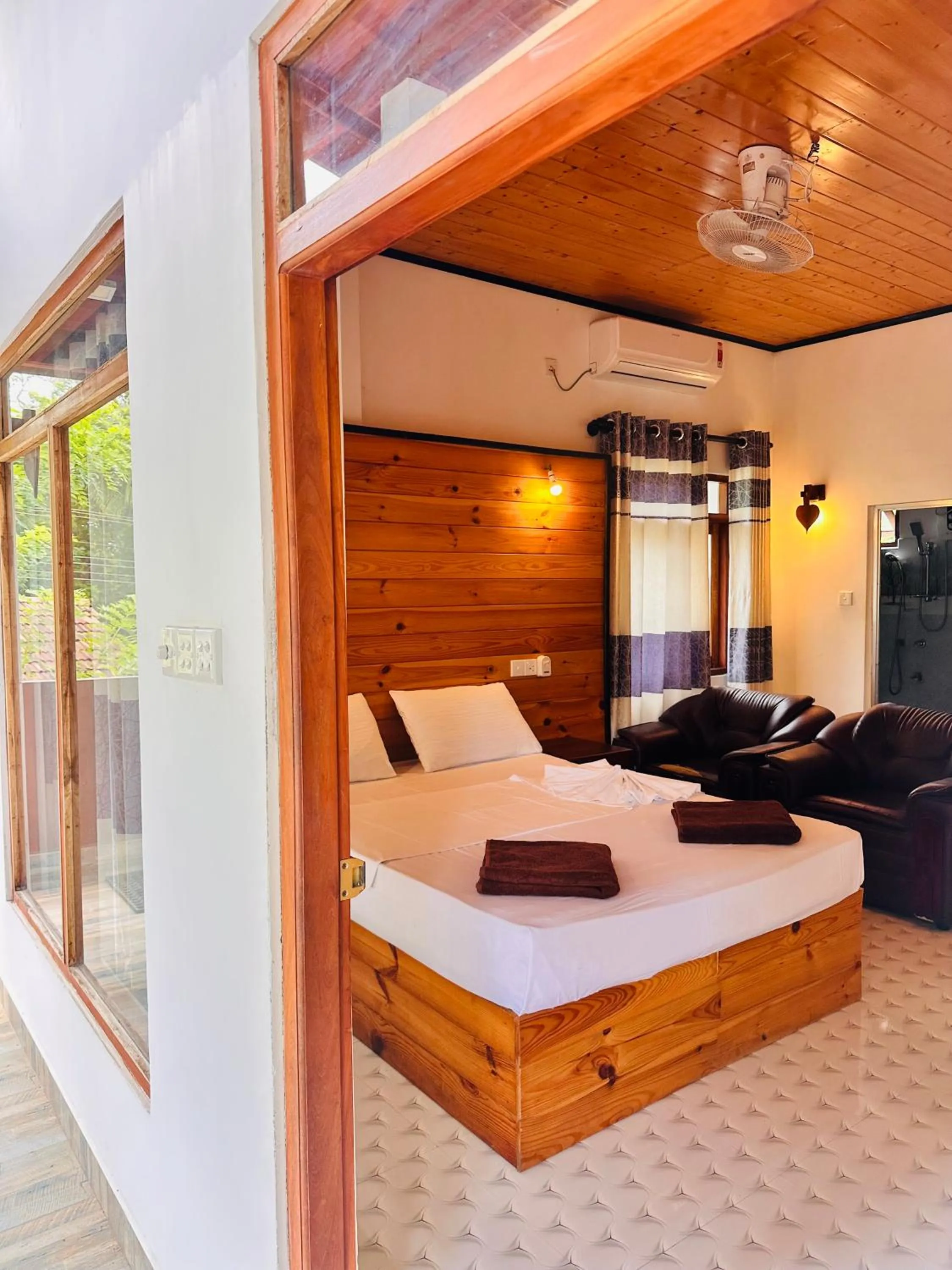 Bed in Rekawa Turtle Gate Hotel