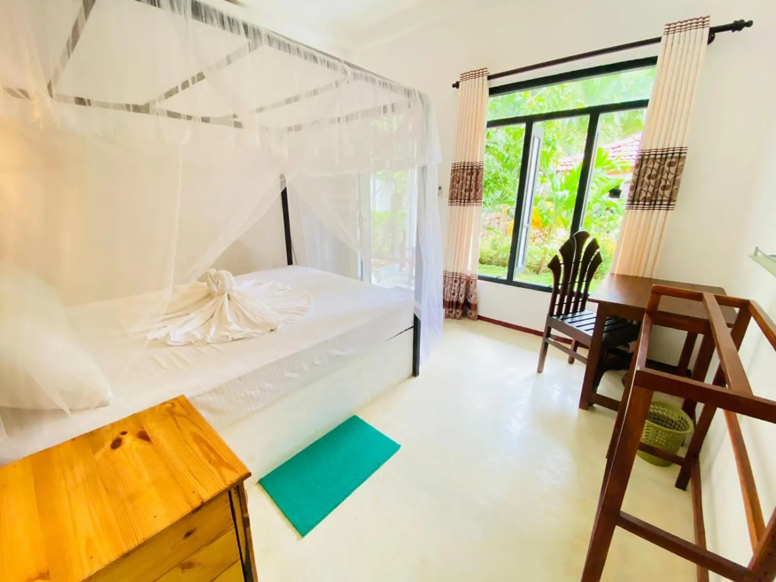 Bed in Rekawa Turtle Gate Hotel