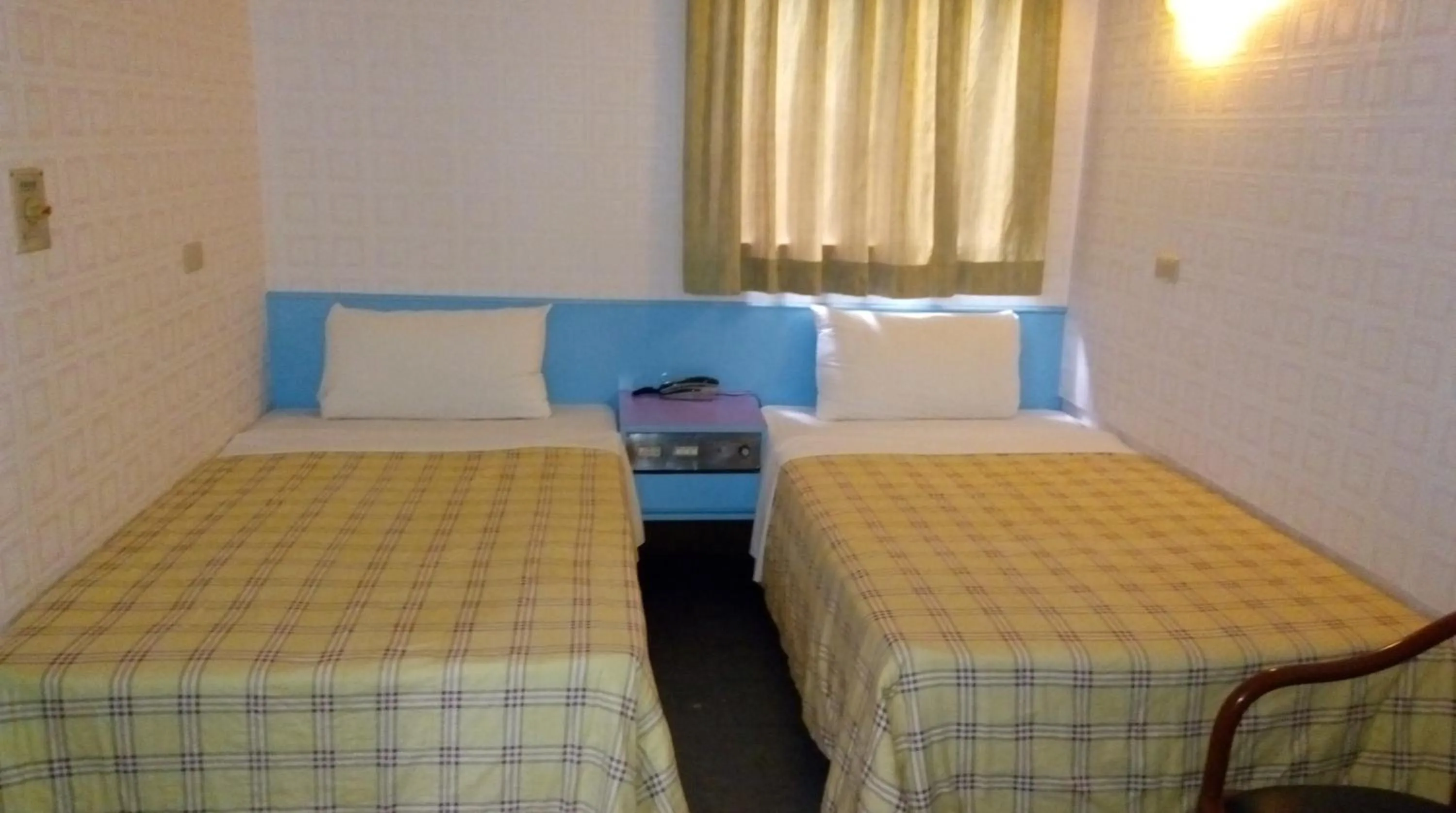 Bed in Reui Chung Hotel