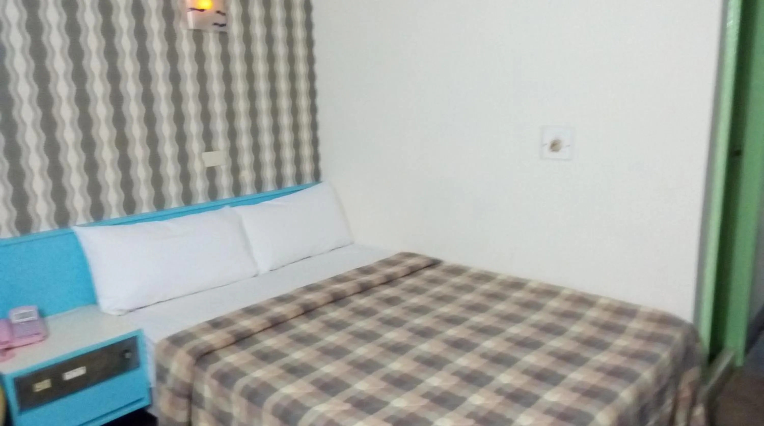 Bed in Reui Chung Hotel