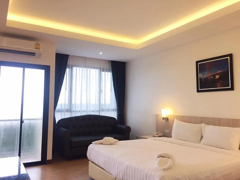 Bed in Orchid Riverview Hotel