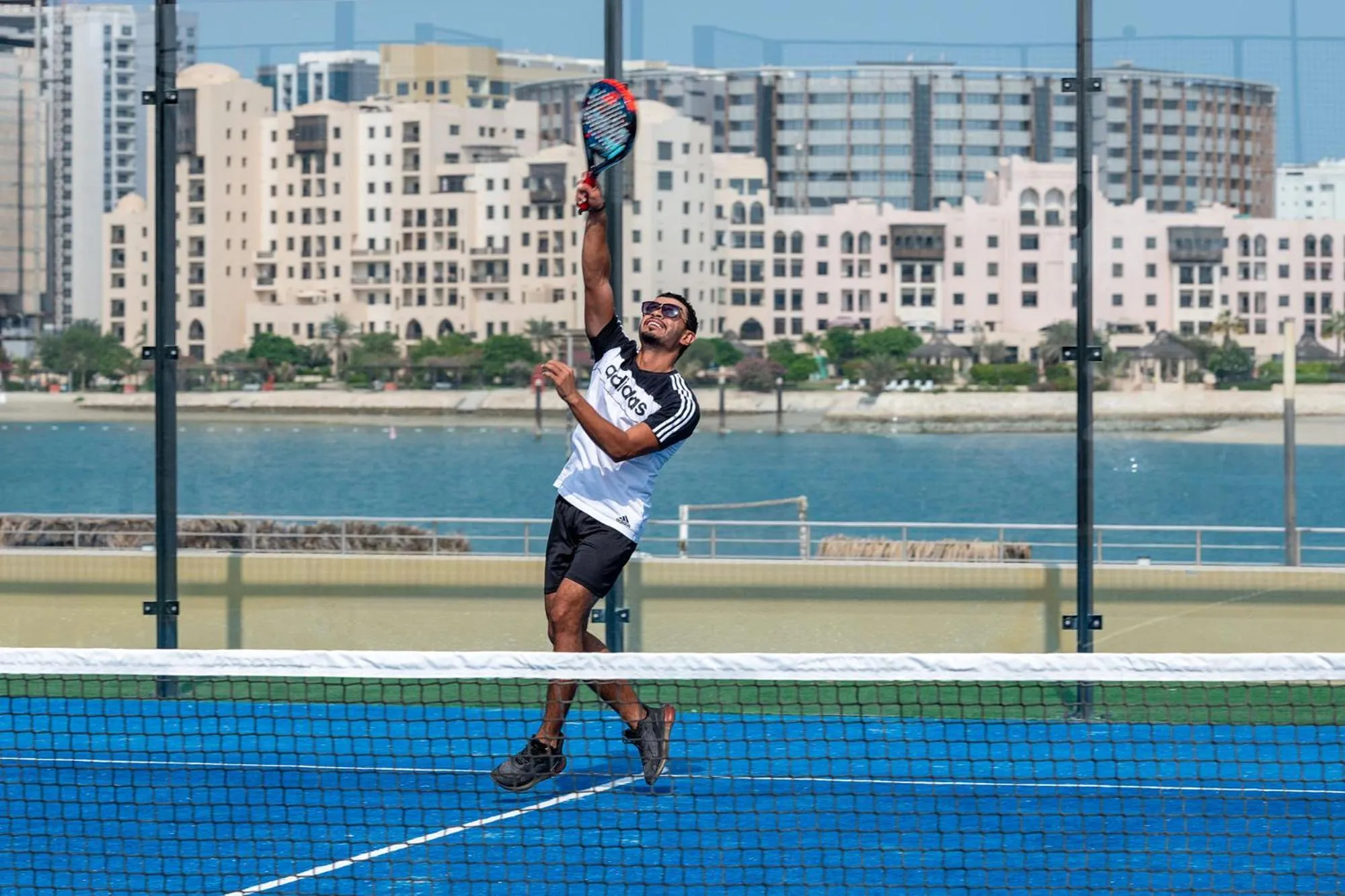 Tennis court in The Grove Resort Bahrain