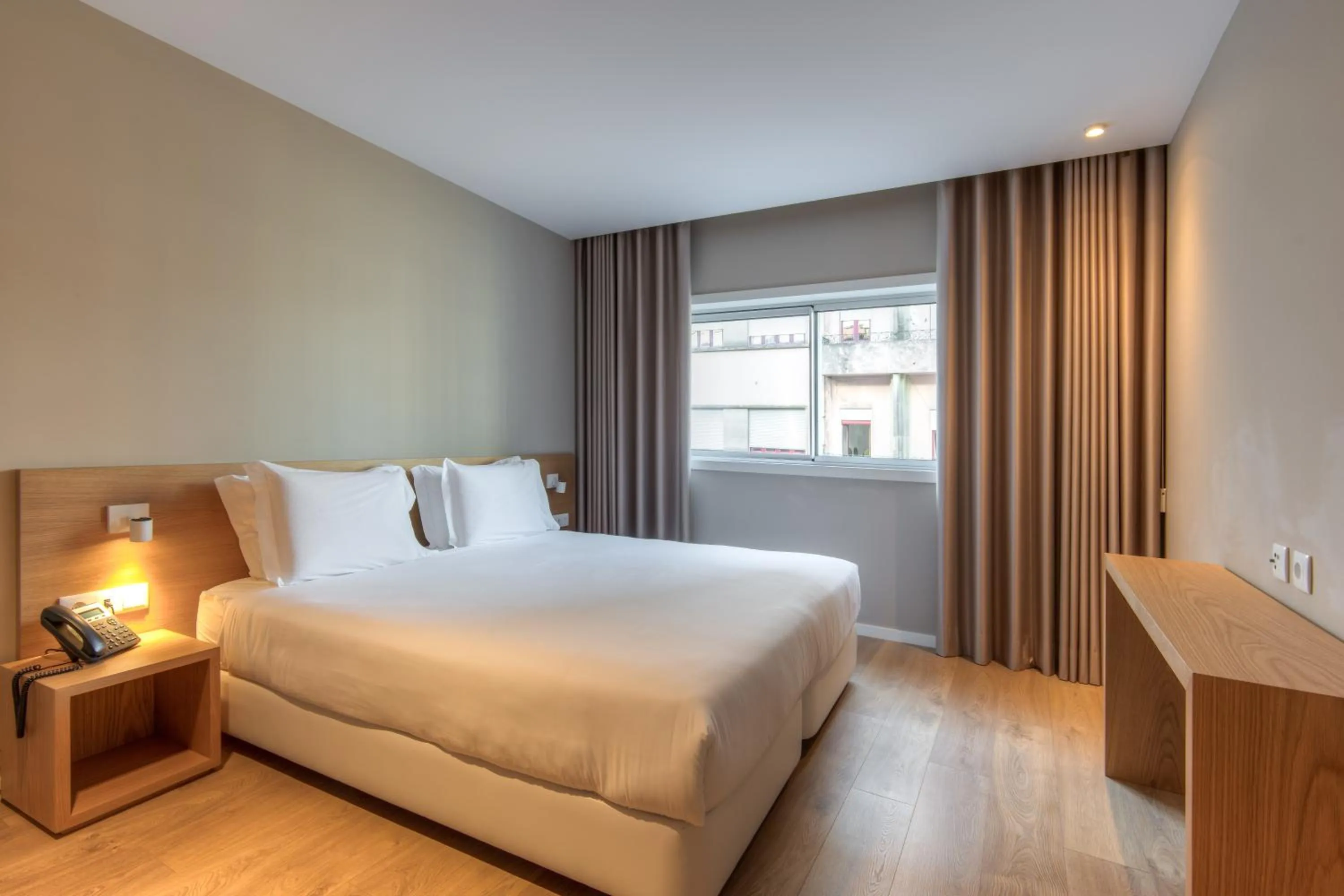 Bed in Spot Family Apartments