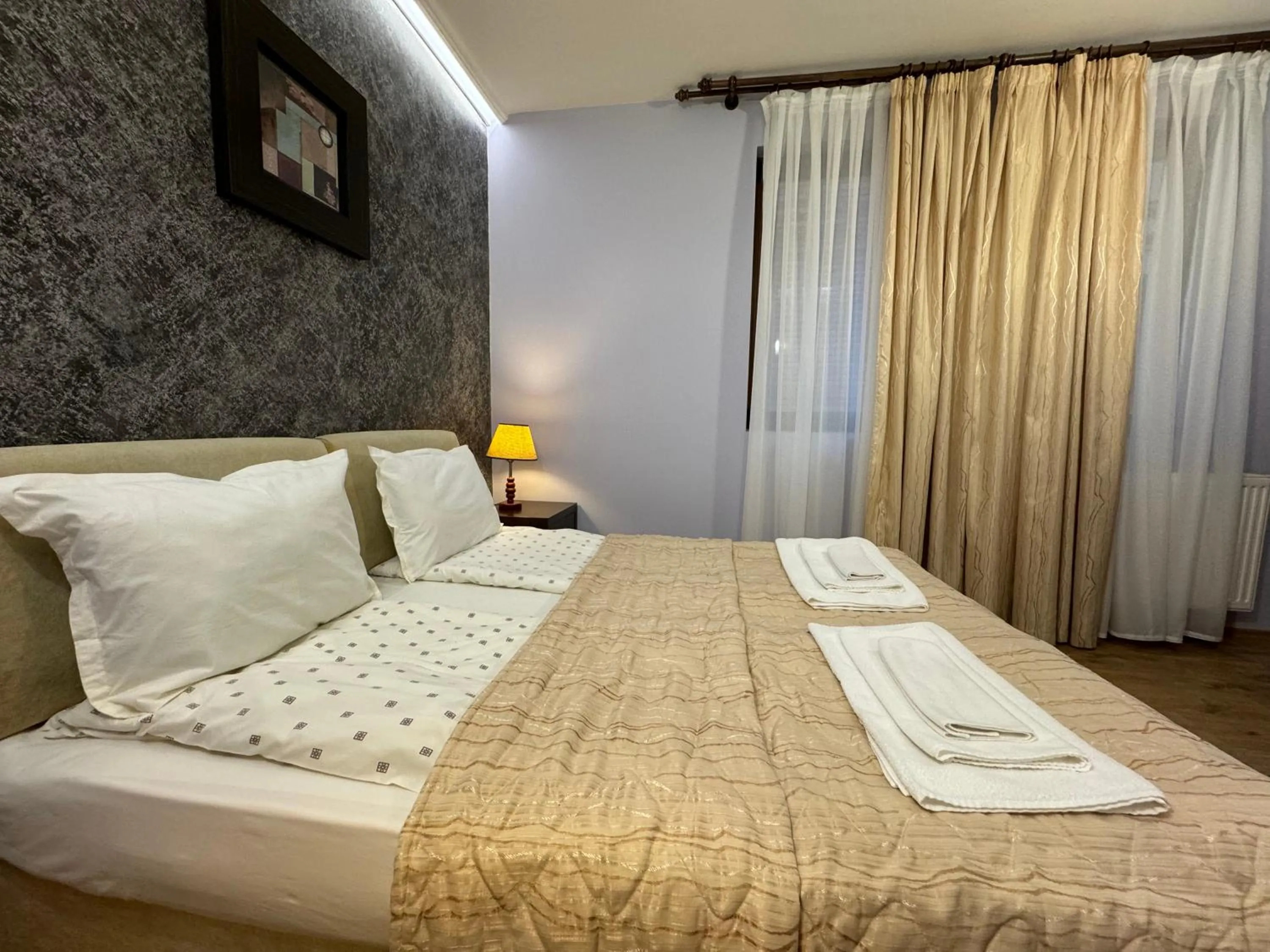 Bed in Family Hotel Eterno