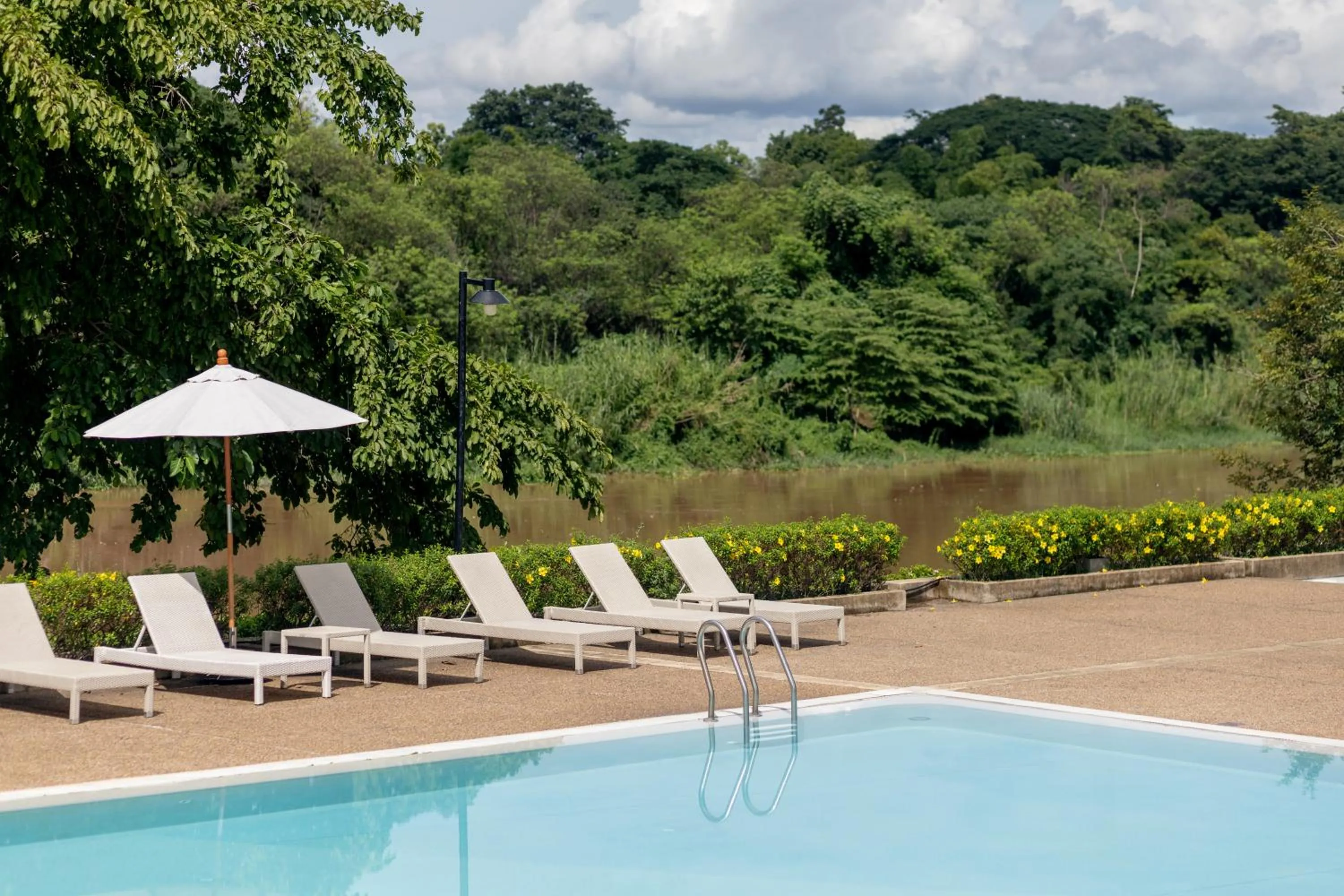 Swimming pool in The Riverie by Katathani