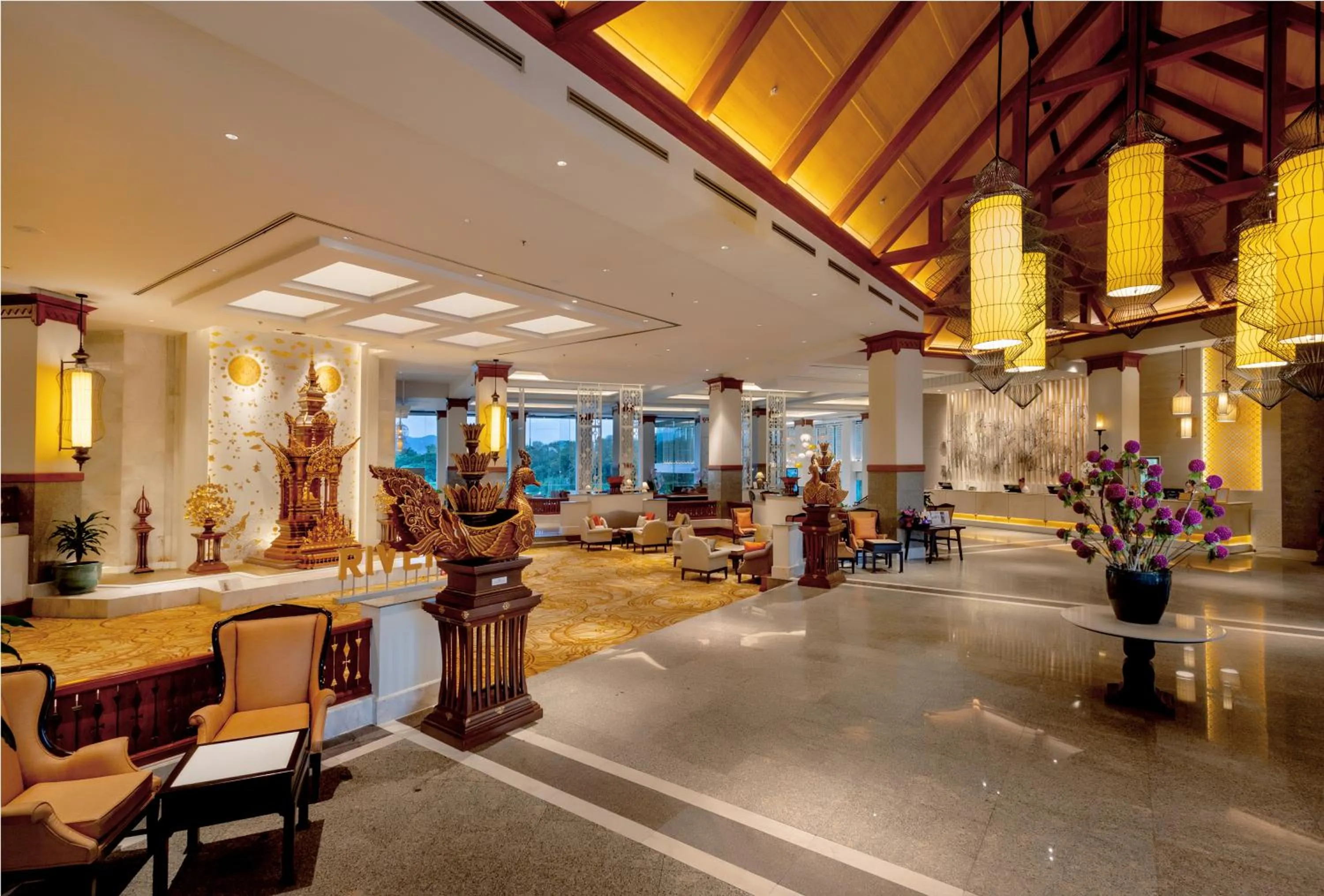 Lobby or reception in The Riverie by Katathani