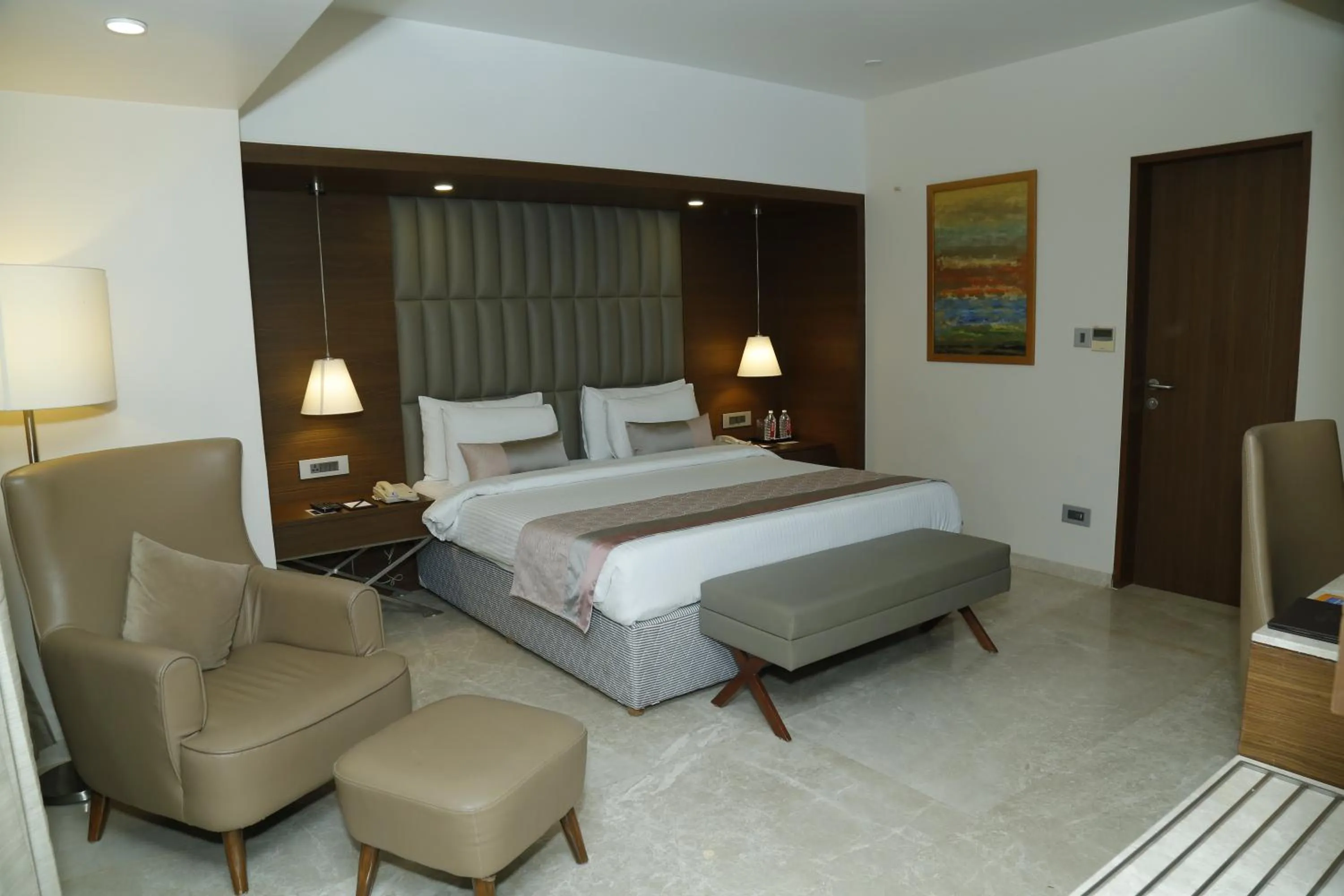 Bed in Sarovar Portico Rivera Ahmedabad