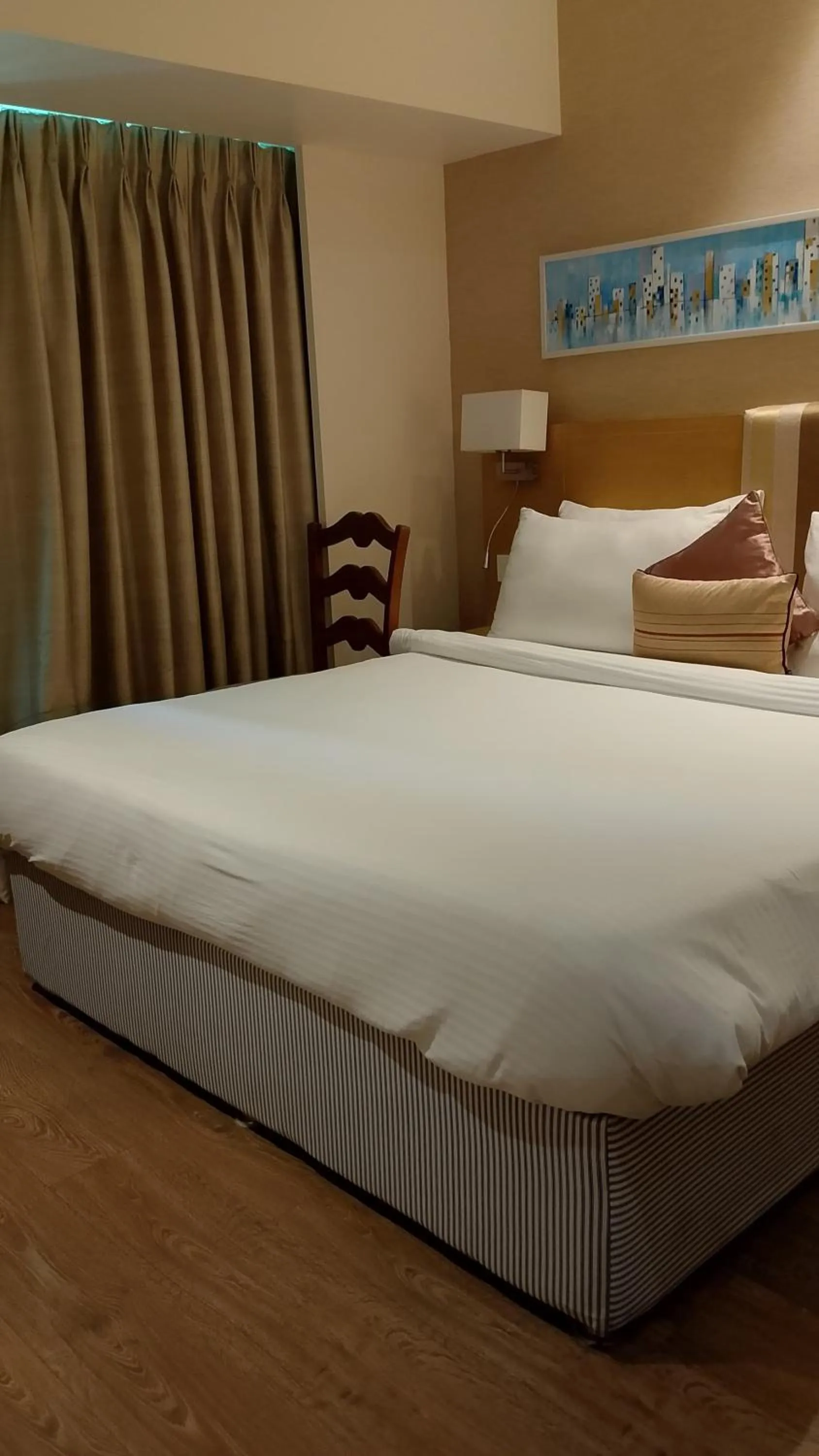 Bed in Sarovar Portico Rivera Ahmedabad