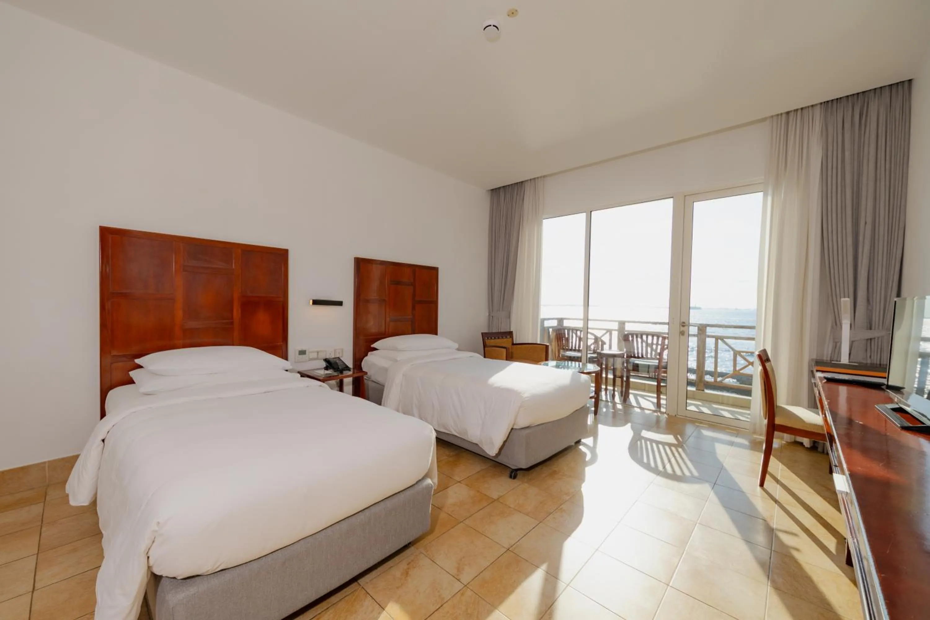 Photo of the whole room, Bed in Hulhule Island Hotel- Private Beach Access & Airport Pick-up and Drop