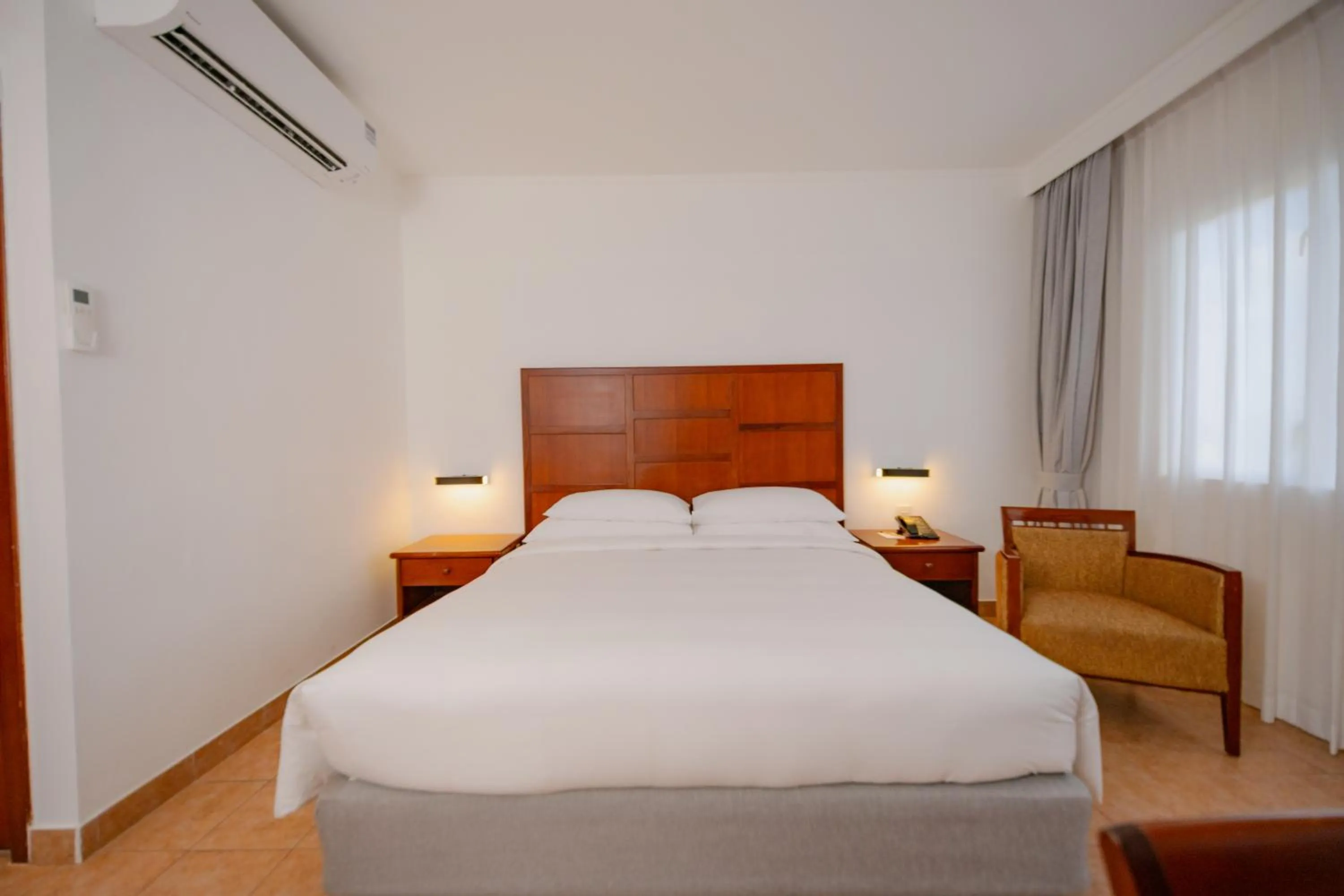 Photo of the whole room, Bed in Hulhule Island Hotel- Private Beach Access & Airport Pick-up and Drop