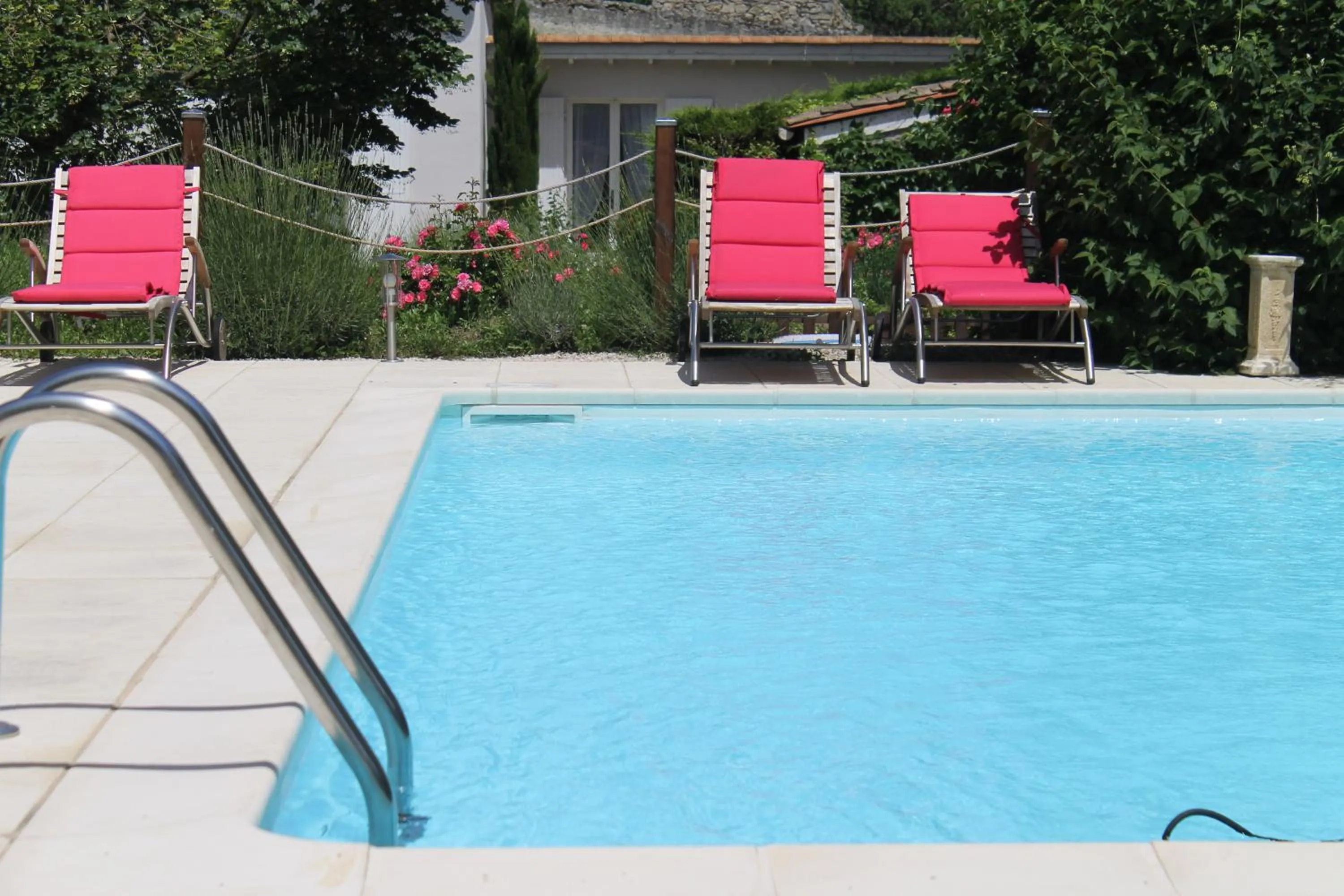 Swimming pool in Hôtel Restaurant La Désirade