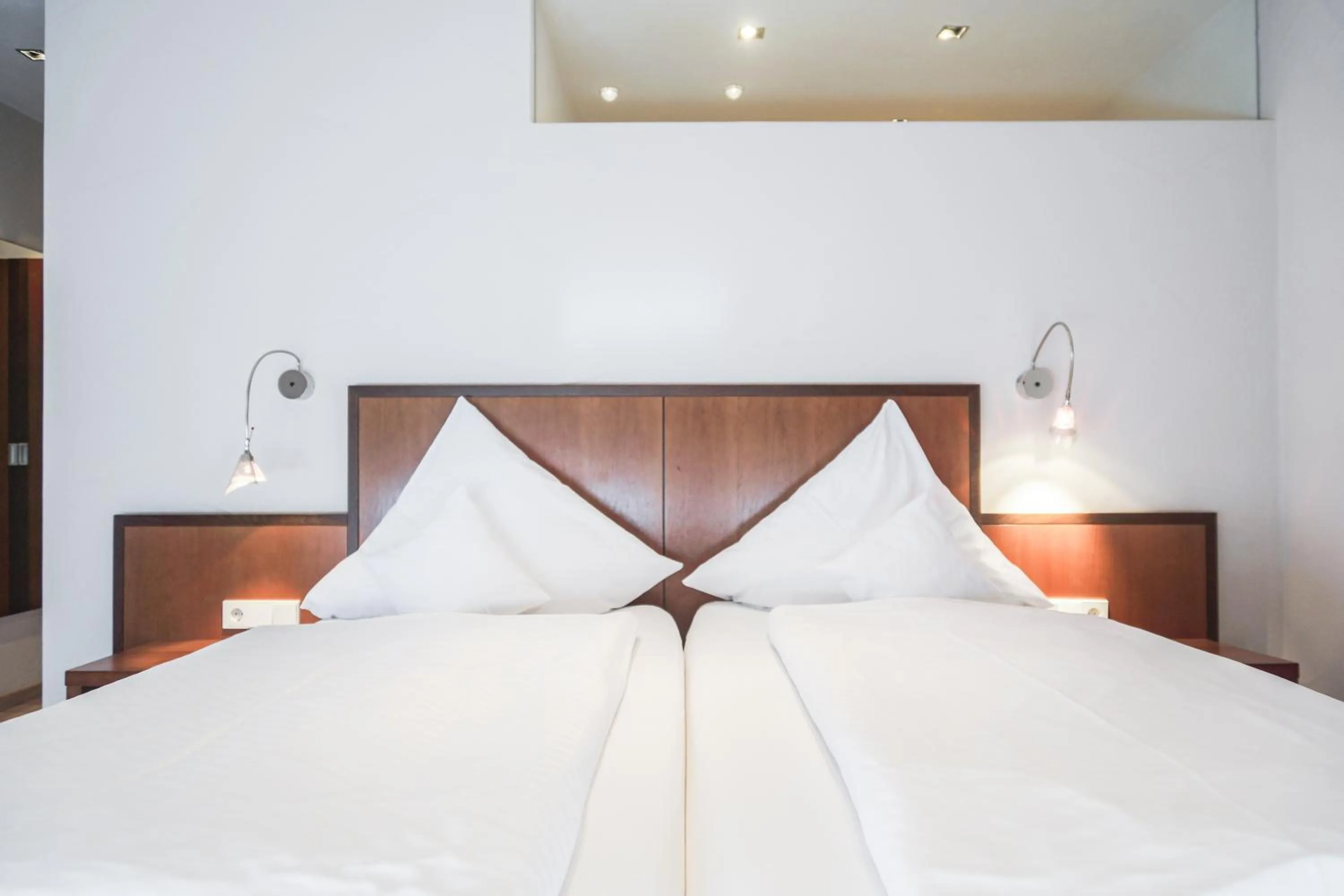 Bed in Hotel Garni in der Breite