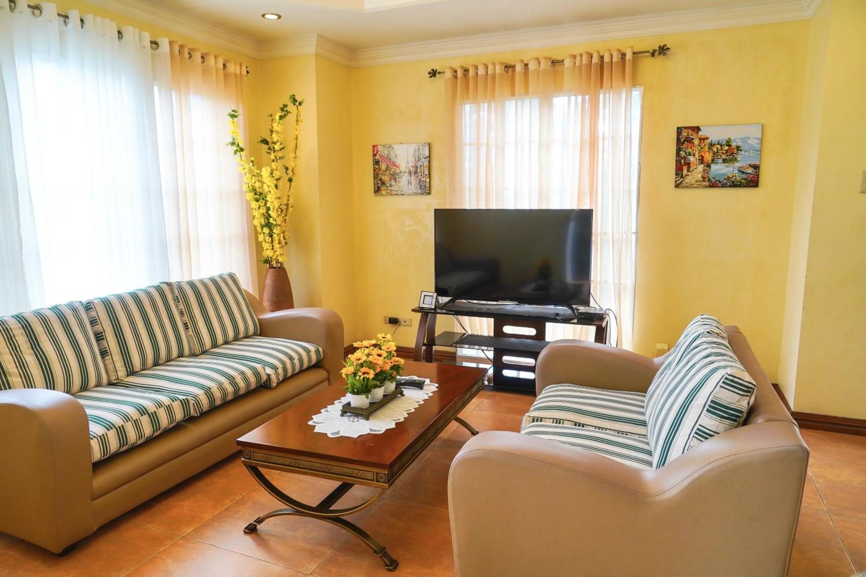 Communal lounge/ TV room in Charming Tagaytay Vacation Home